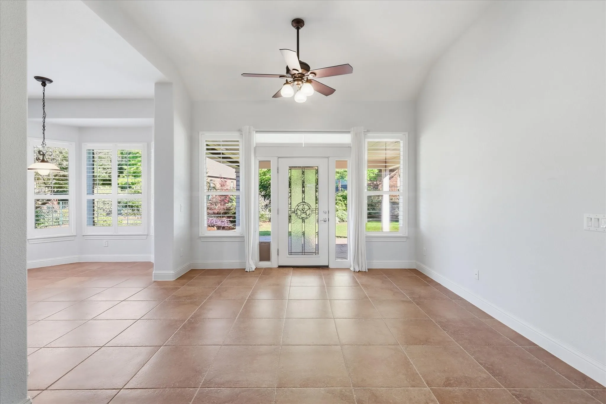 Backdoor to the covered patio and large backyard.