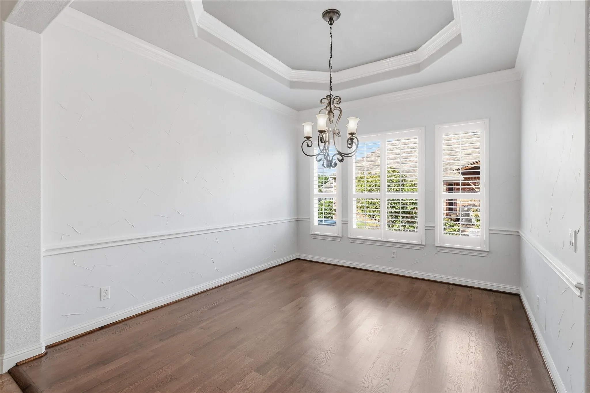 Tray ceilings accent the dining room.