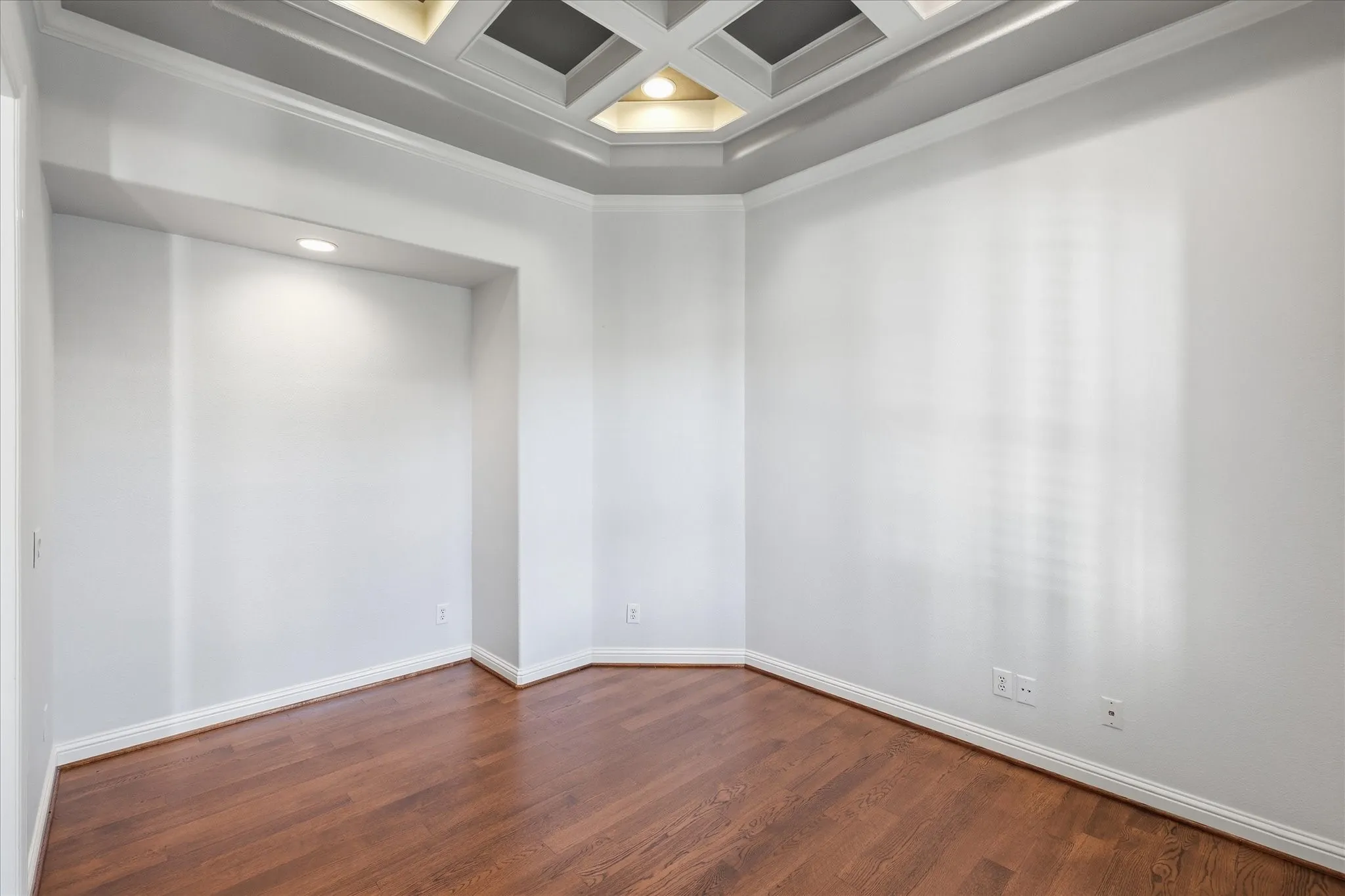 Spacious office with coffered ceilings.