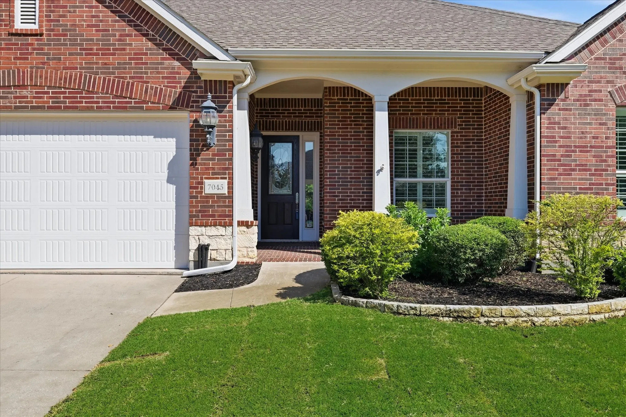 Covered entry with front porch.