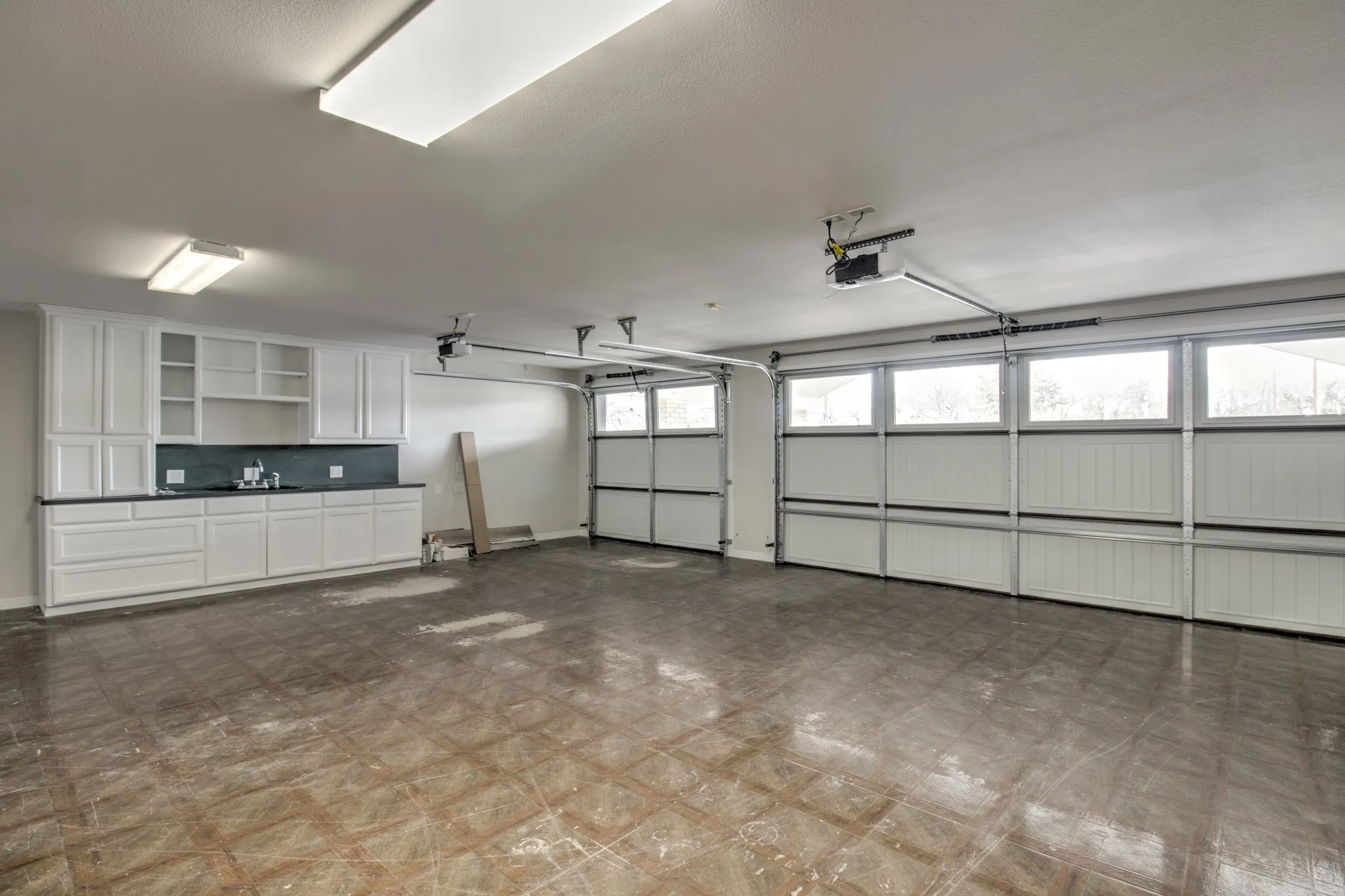 New Garage Doors, with opener. Sink in garage for convenience, perfect space for 2 vehicles, motorcycle/side by side/golf cart.