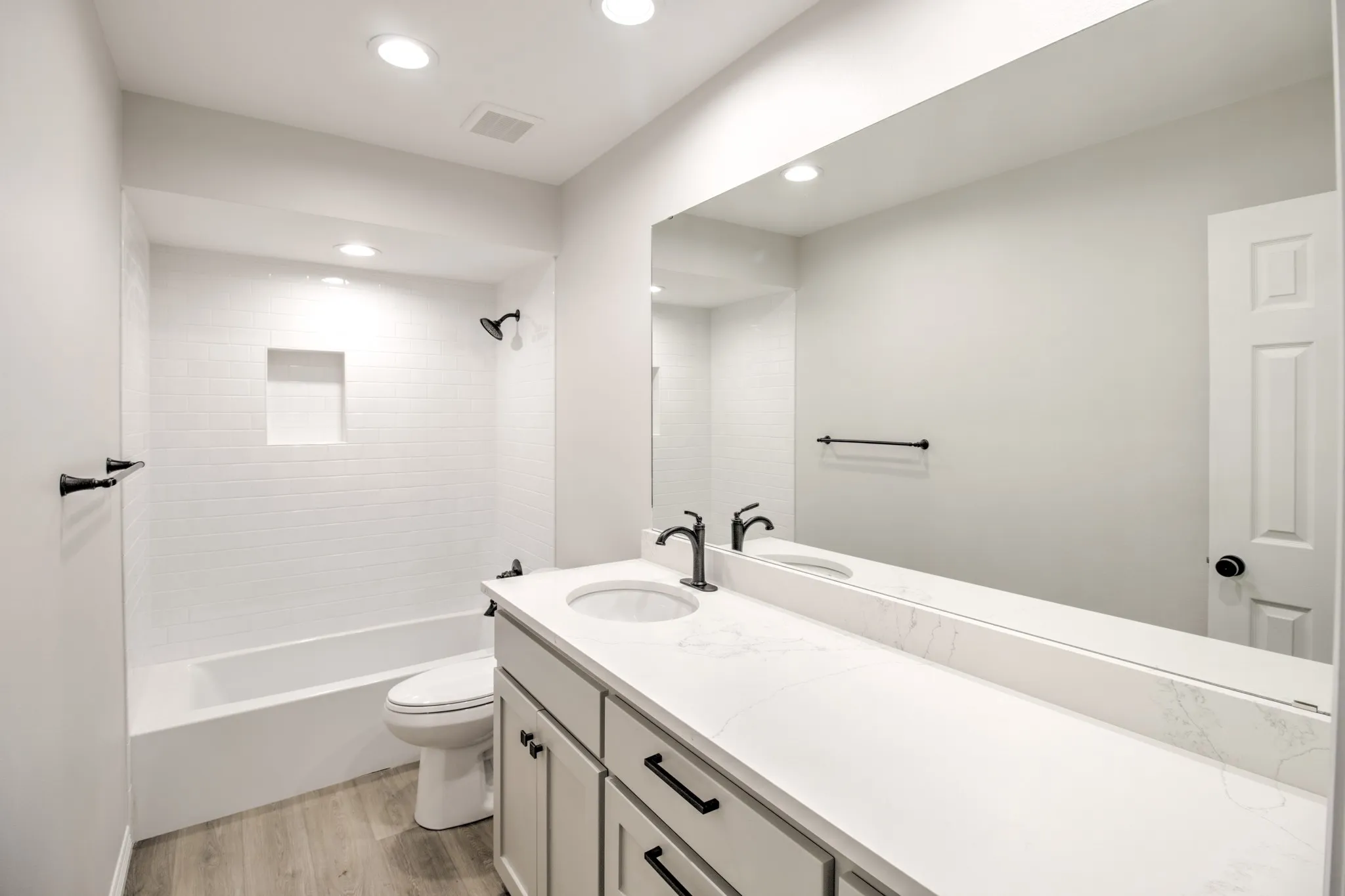 Full Bathroom with Quartz Countertops.