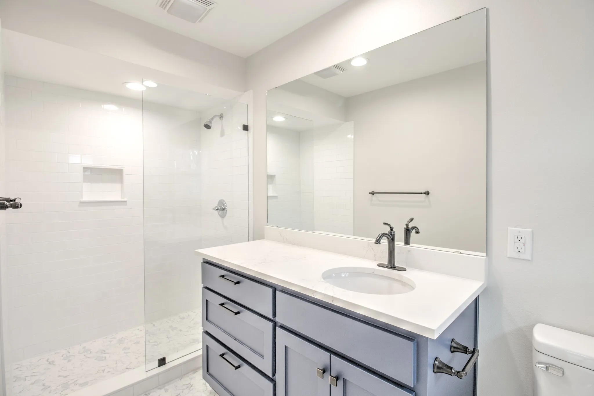Ensuite Bathroom, quartz counter tops, with walk in shower.