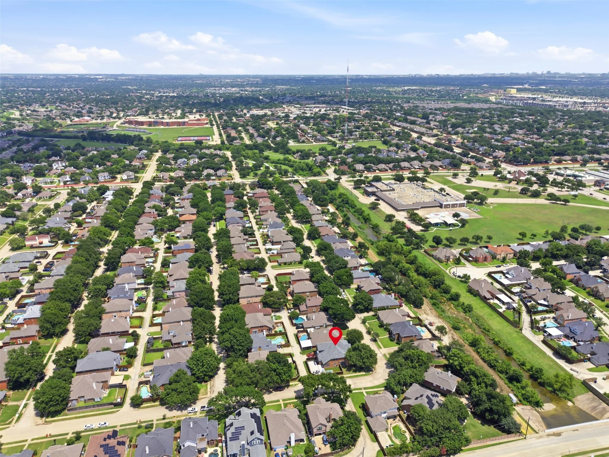 Residential area with established landscaping and a dense arrangement of single-family homes
