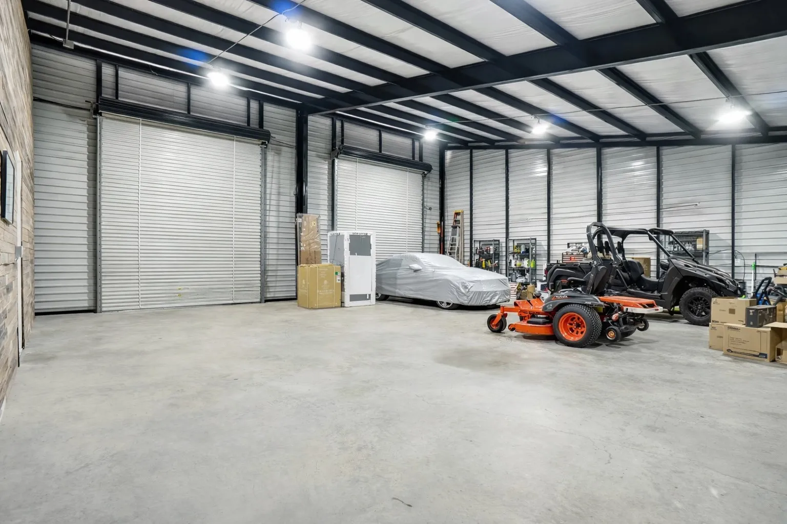 Huge shop area with oversized rollup doors.