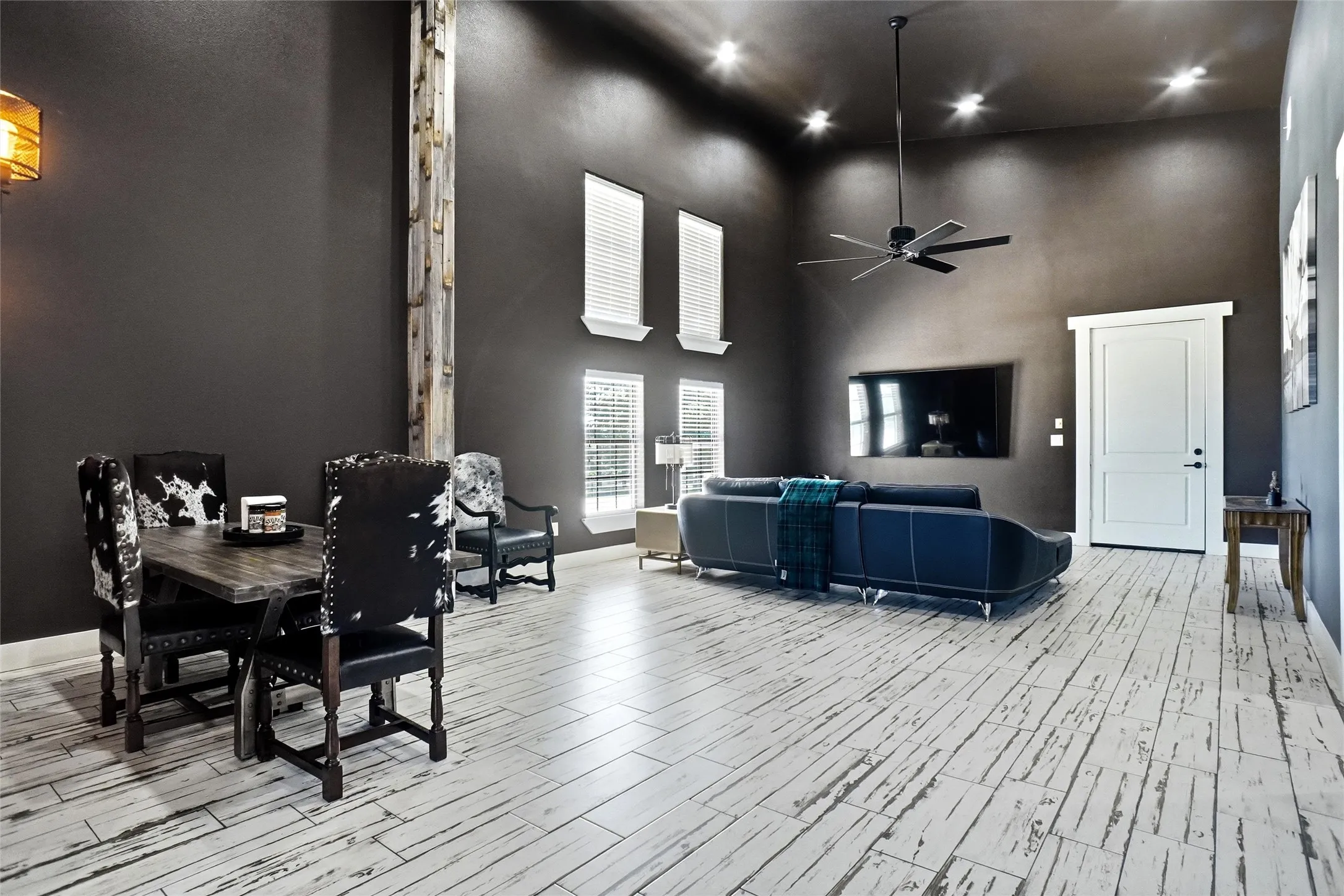 View of living area in secondary living quarters. Door leads to shop area, with primary suite to the right of this photo.