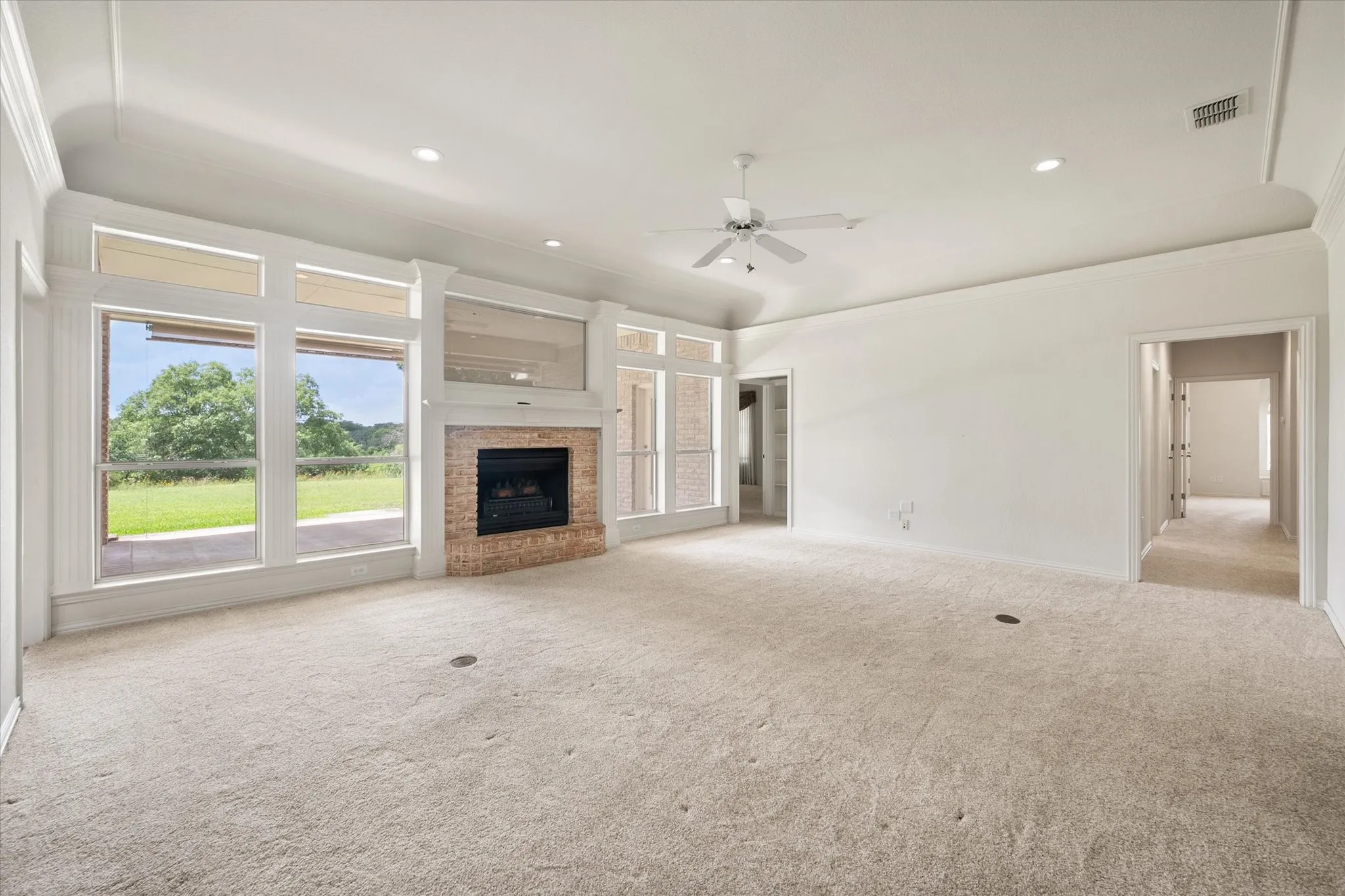 Living room with a wall of windows.