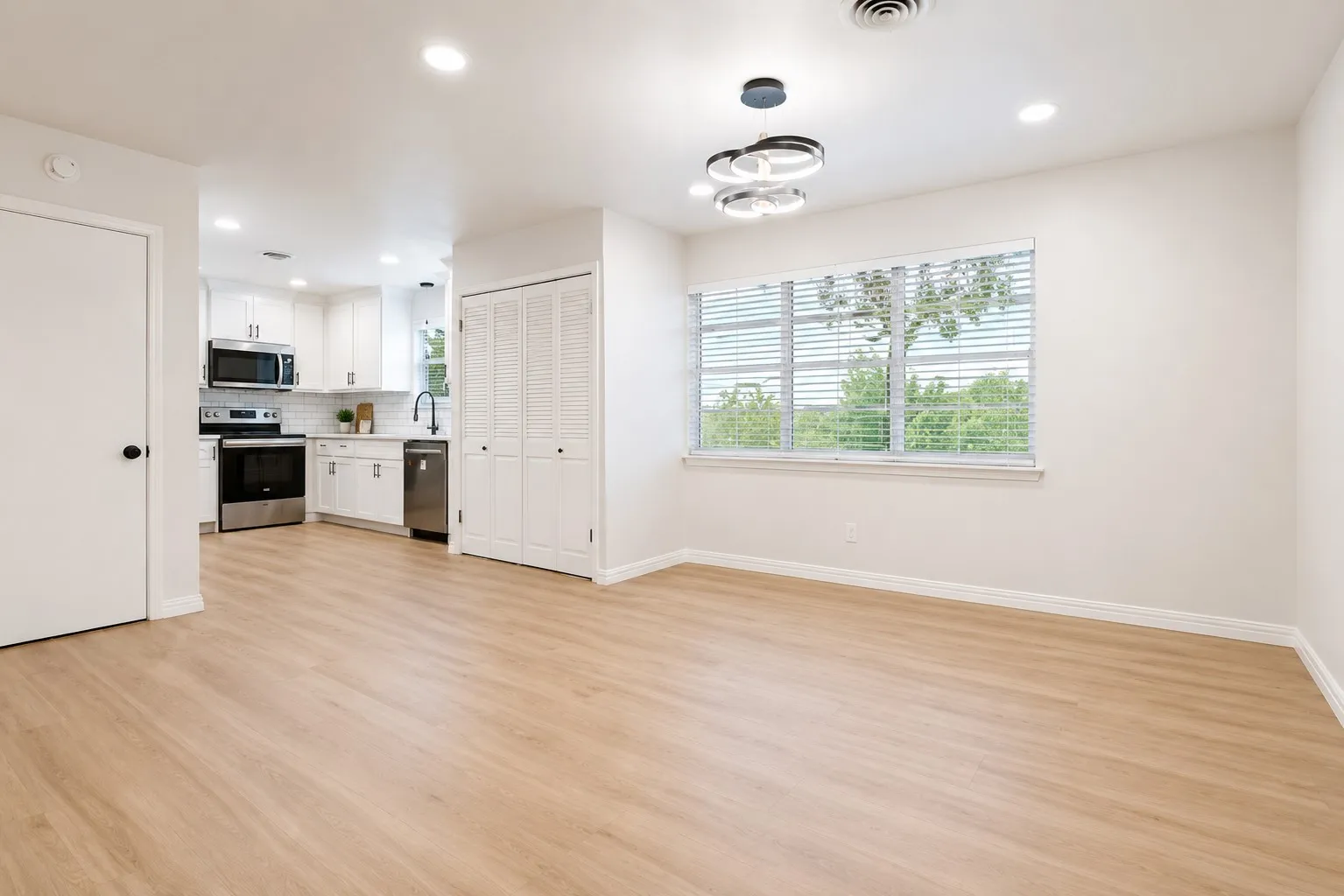 1st Level - Dining Room, open space, with light flooring and natural lighting throughout.