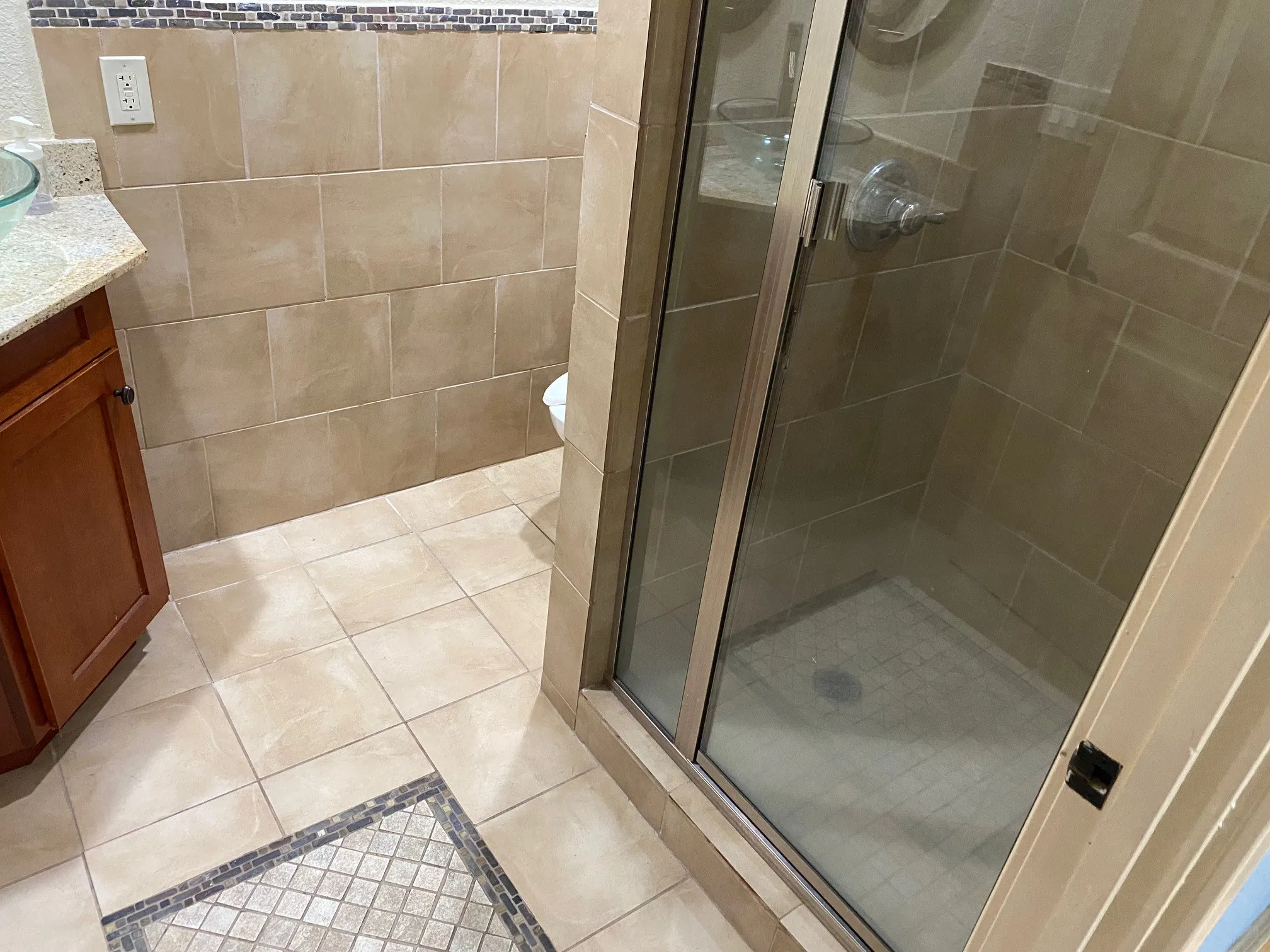 Master Bath Shower and tile patern flooring.