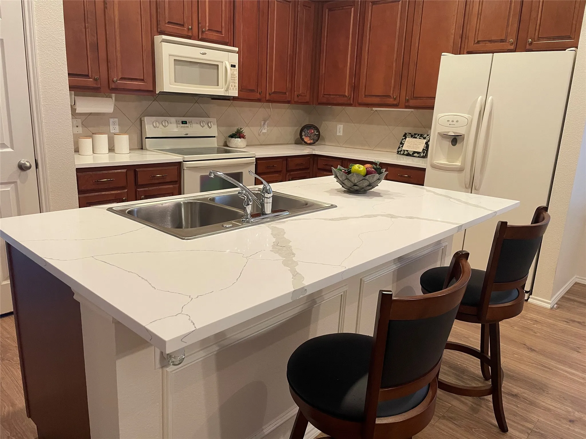 New quartz countertops installed. Refrigerator, washer & dryer can convey with the home!