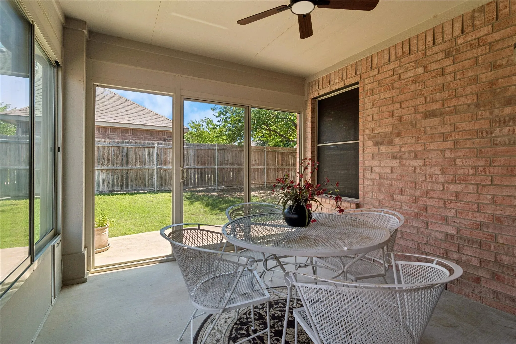 Enclosed patio offers screens & glass to provide comfort & keep your picnic rain, fly & mosquito free