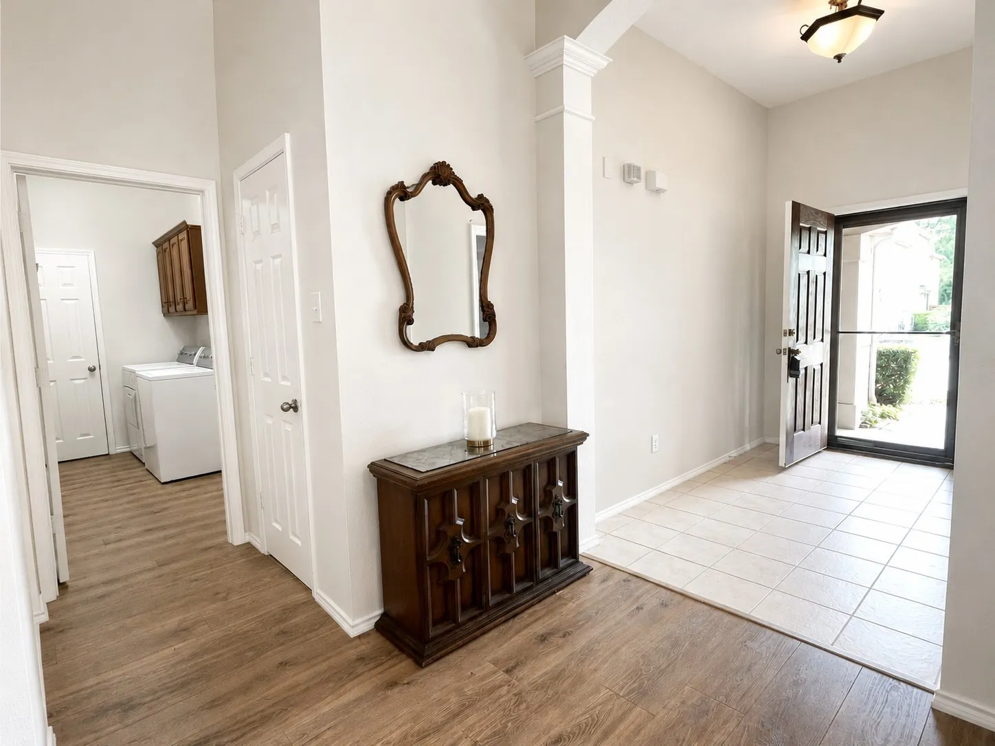 Walk past the study at left to coat closet & utility at right.