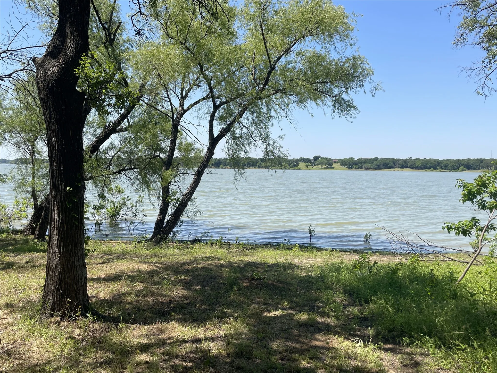 Walking trails to Lake Lewisville are steps away from this home!