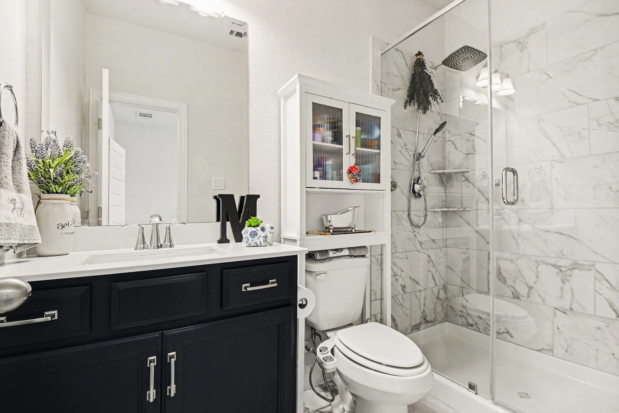 Contemporary bathroom featuring a dark wood-finish vanity with a white countertop and rectangular undermount sink