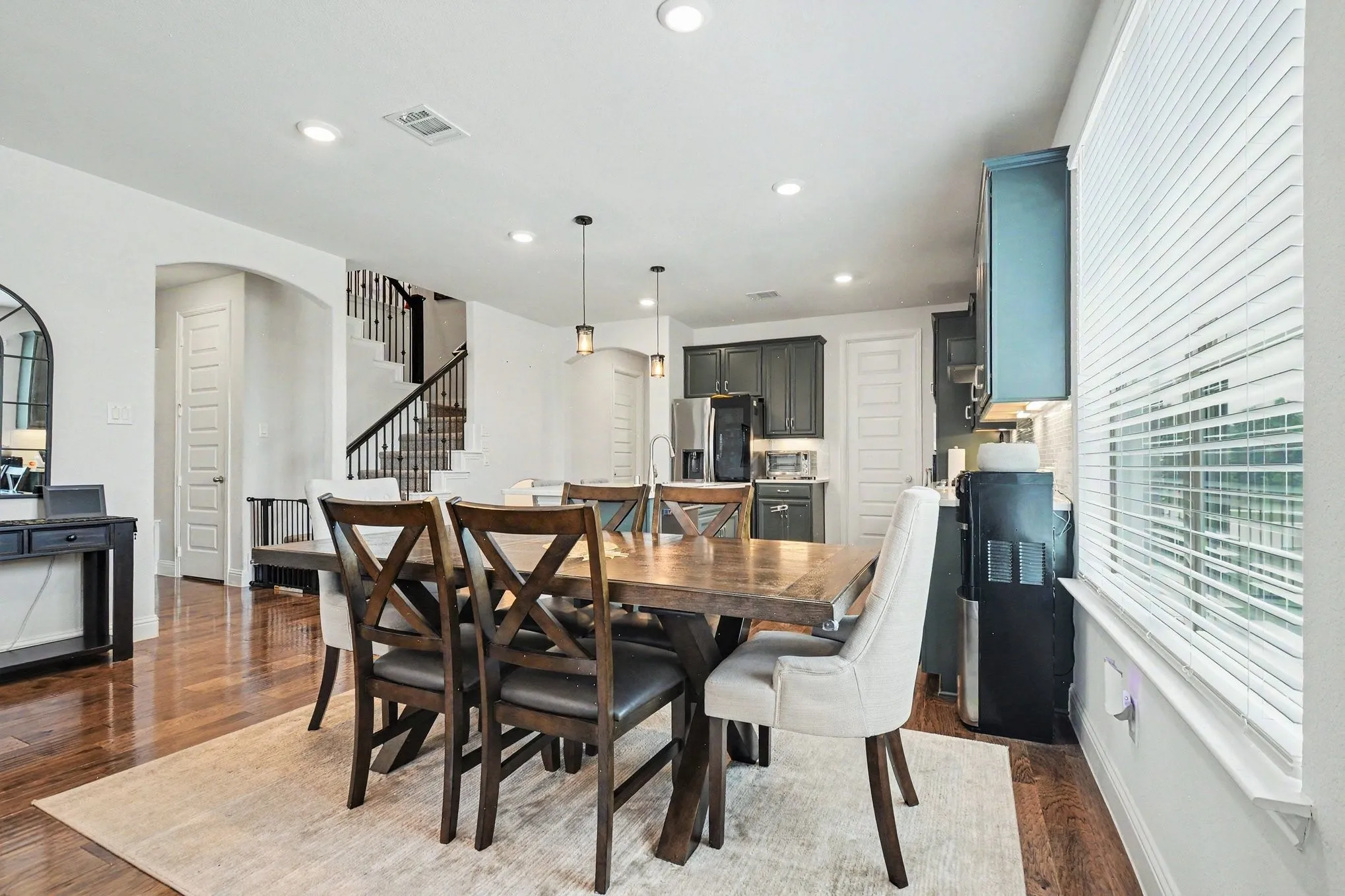 Open-concept living area with dark wood-finish flooring