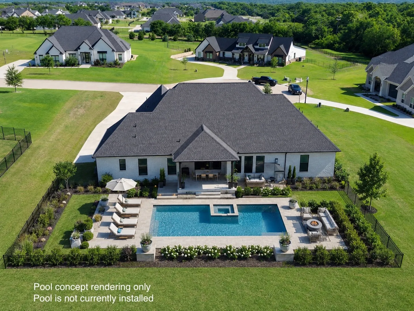 Exterior rear of a contemporary residence featuring a dark shingle roof and white brick facade
