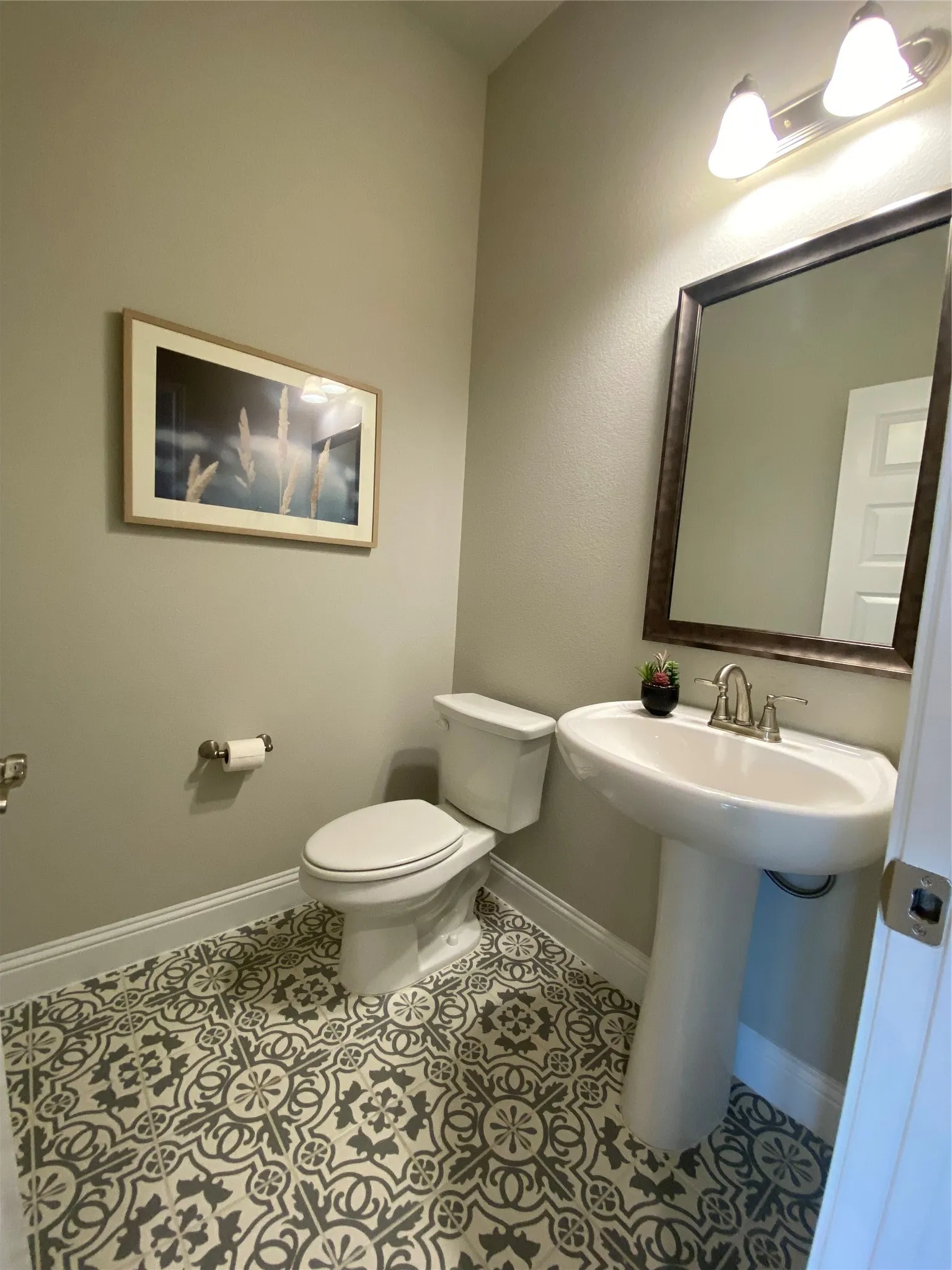 Bathroom with toilet and tile floors