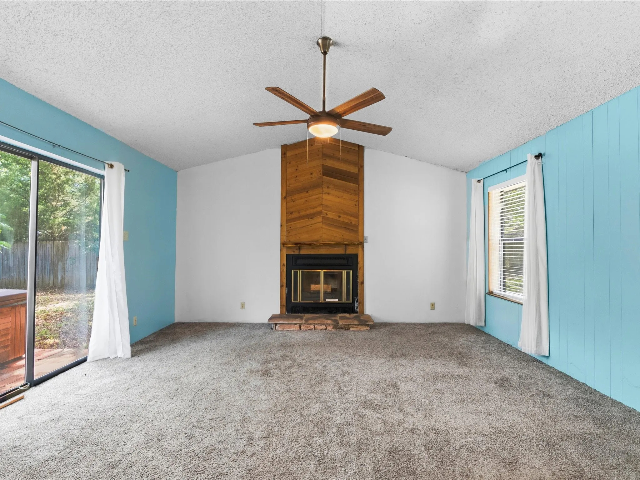 Wood burning fireplace and access to back porch.
