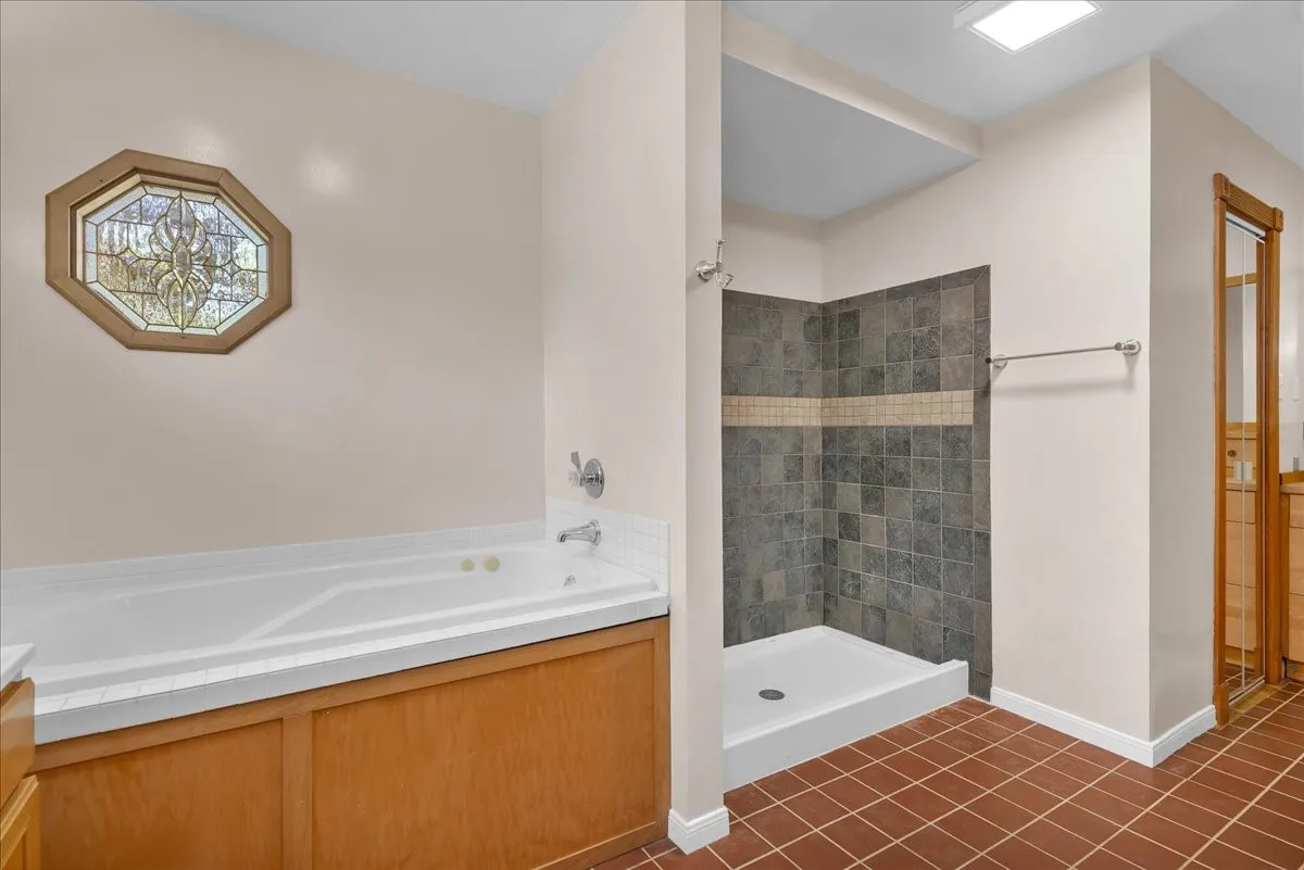 Another view of the primary bathroom facing the separate shower. This bathroom is huge!