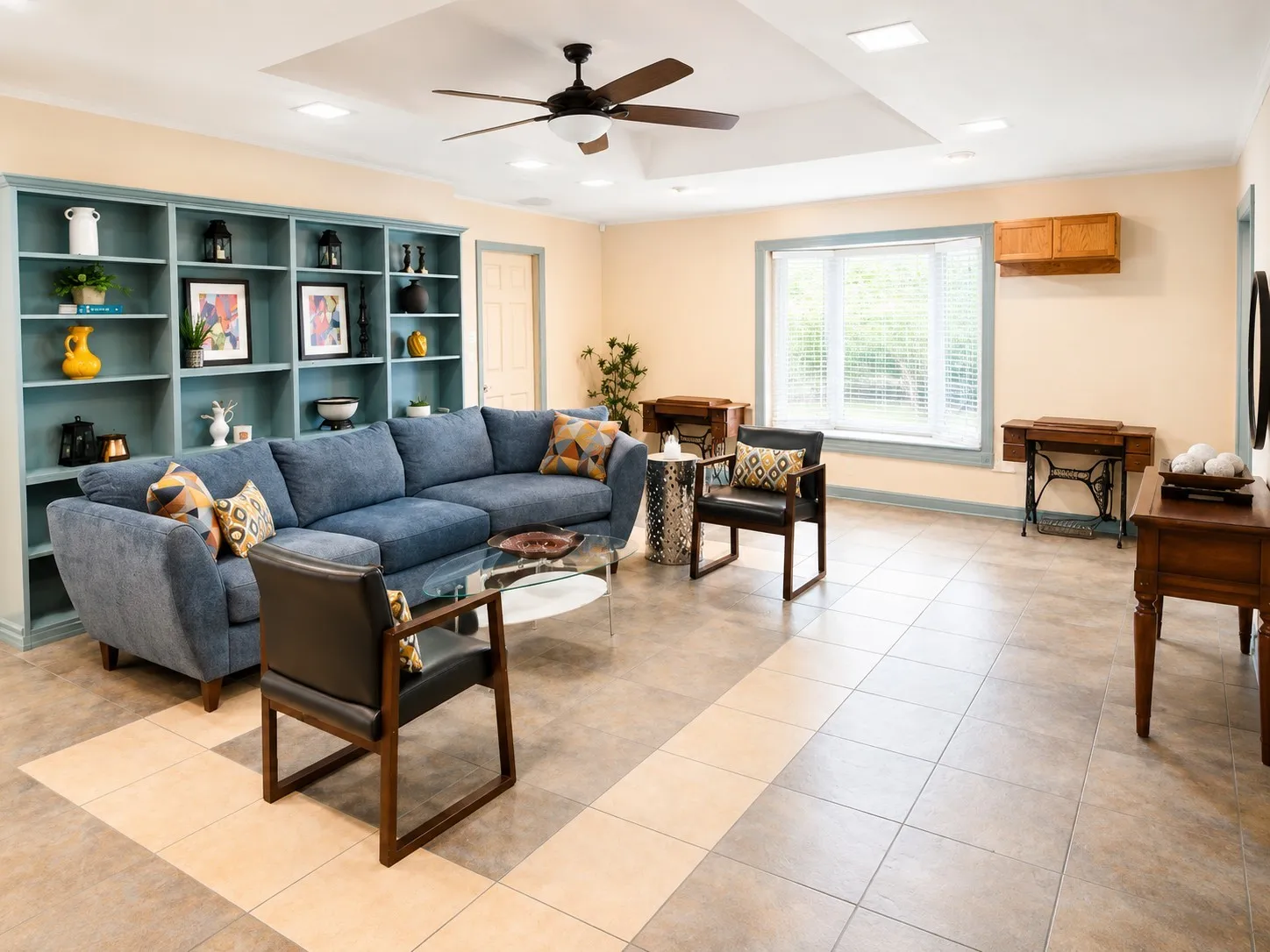 Another view of the oversized living room featuring the bay window with natural light.