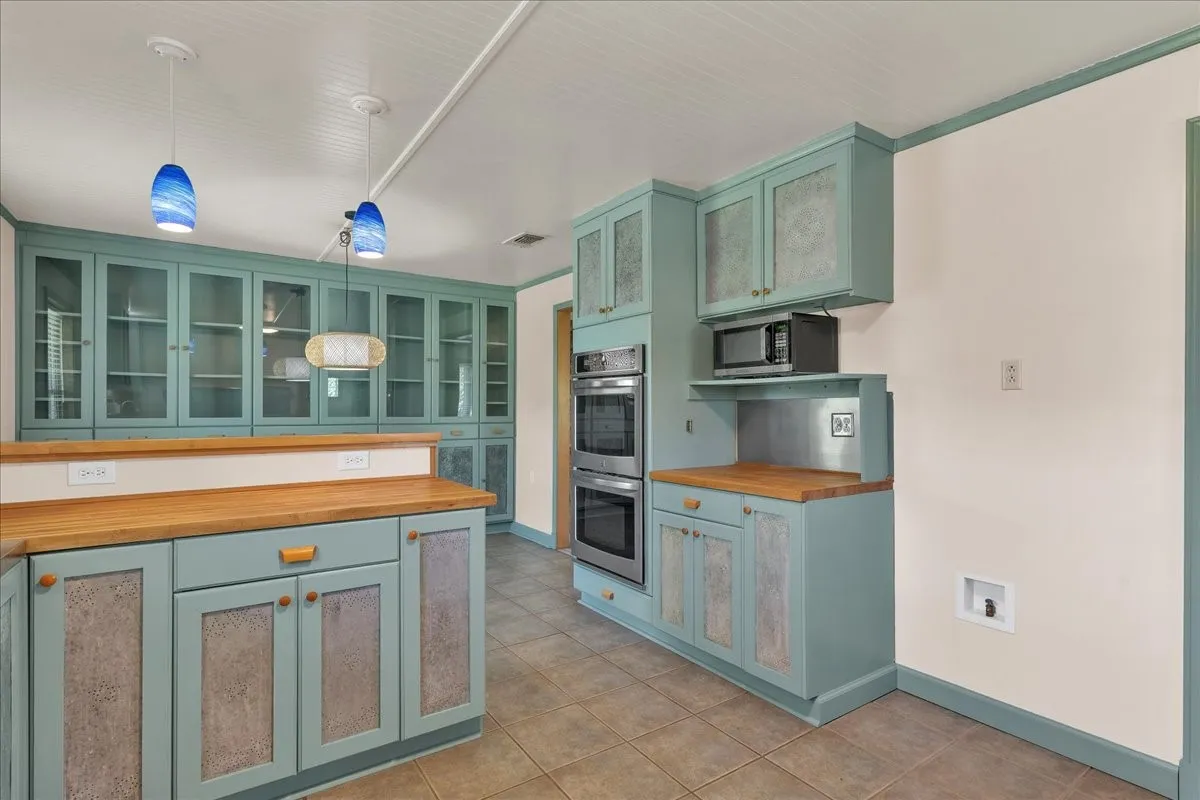 View of the kitchen facing the breakfast area; notice the built-ins!