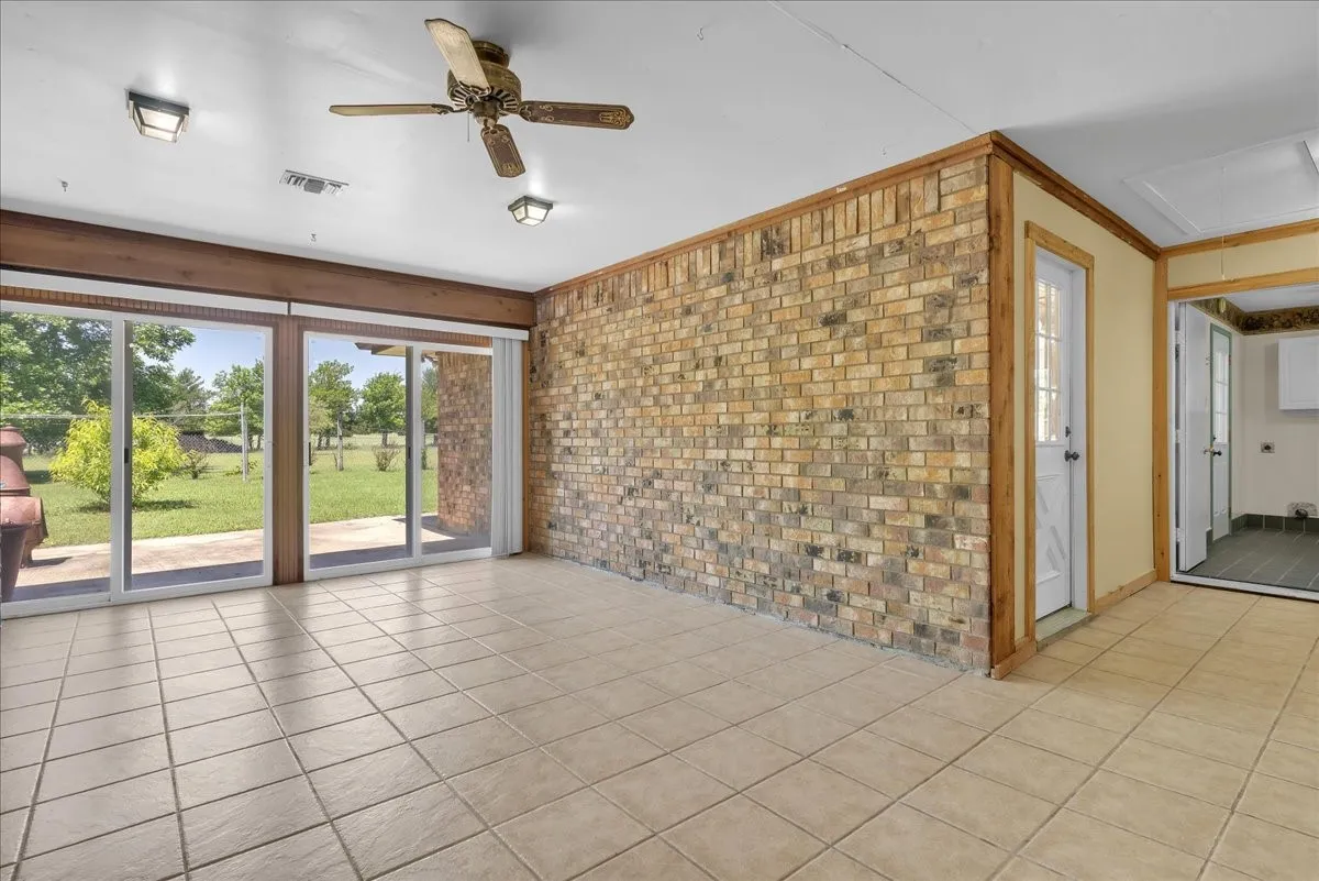 Another view of the bonus room facing the double sliding glass doors; tons of natural light!