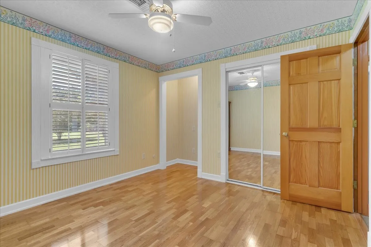 Another view of Guest bedroom 2 with mirrored cedar-lined closet.