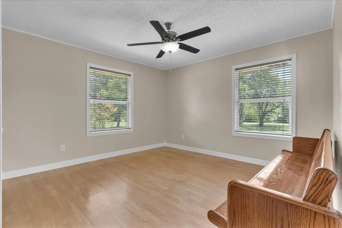 Guest bedroom 3 with ceiling fan, natural light, and gorgeous ceiling!
