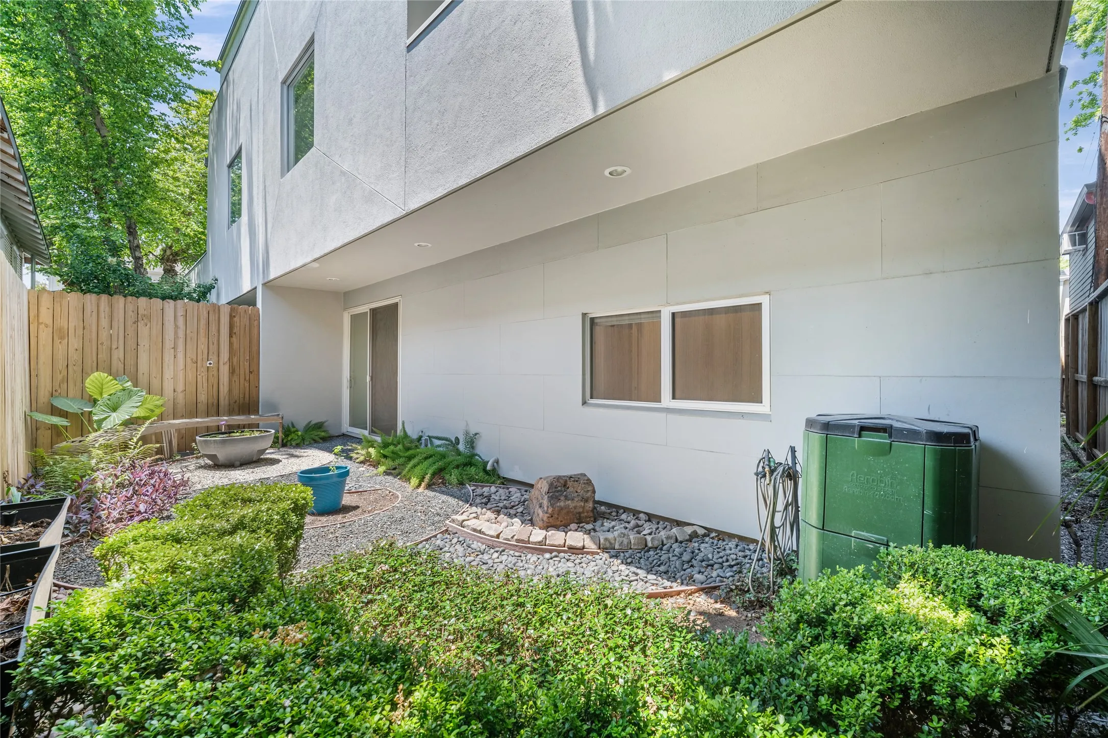 Modern exterior with a white stucco finish and flat roofline