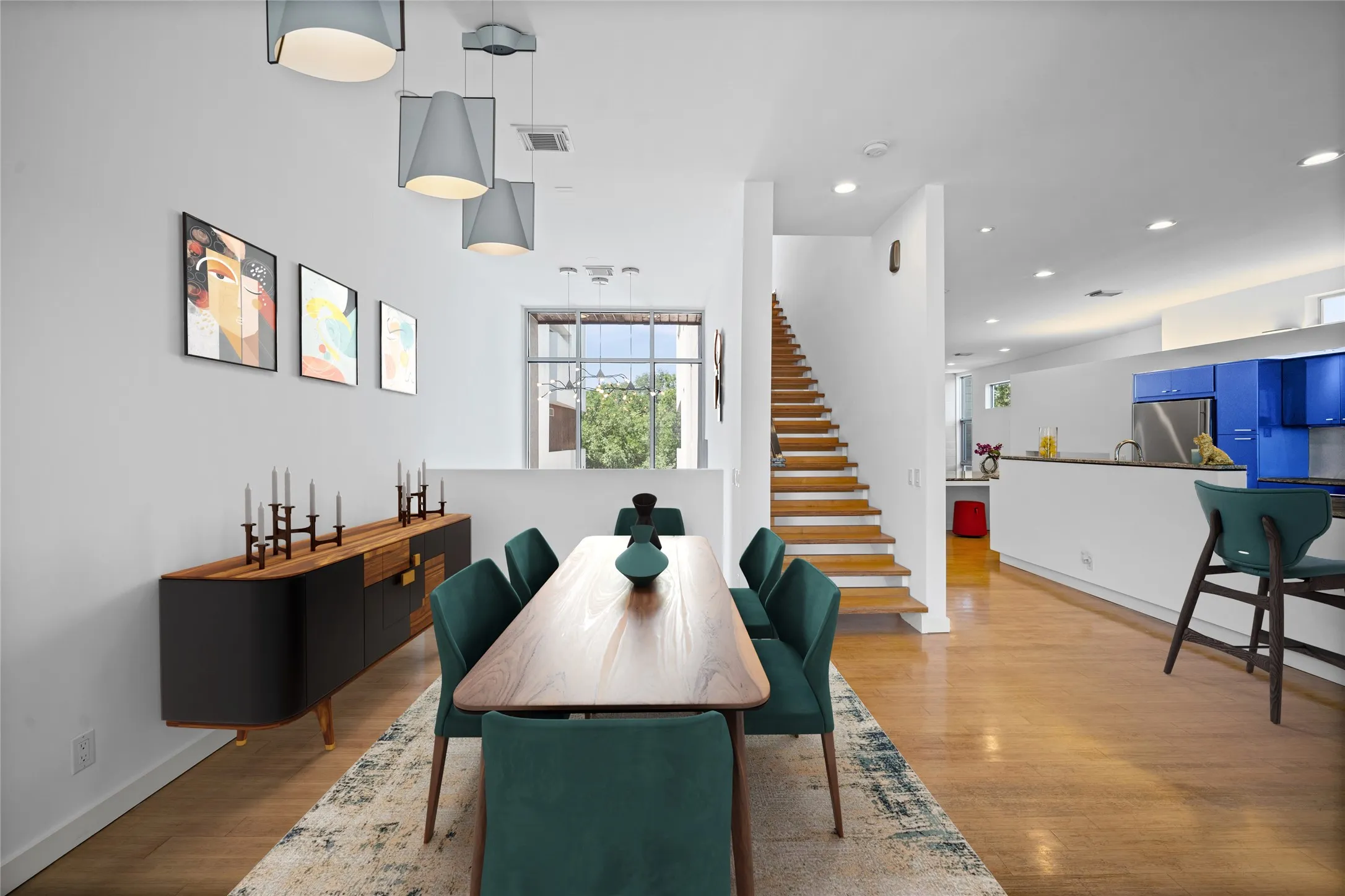 VIRTUALLY STAGED!  ight wood-finish flooring throughout the open-concept dining area and kitchen