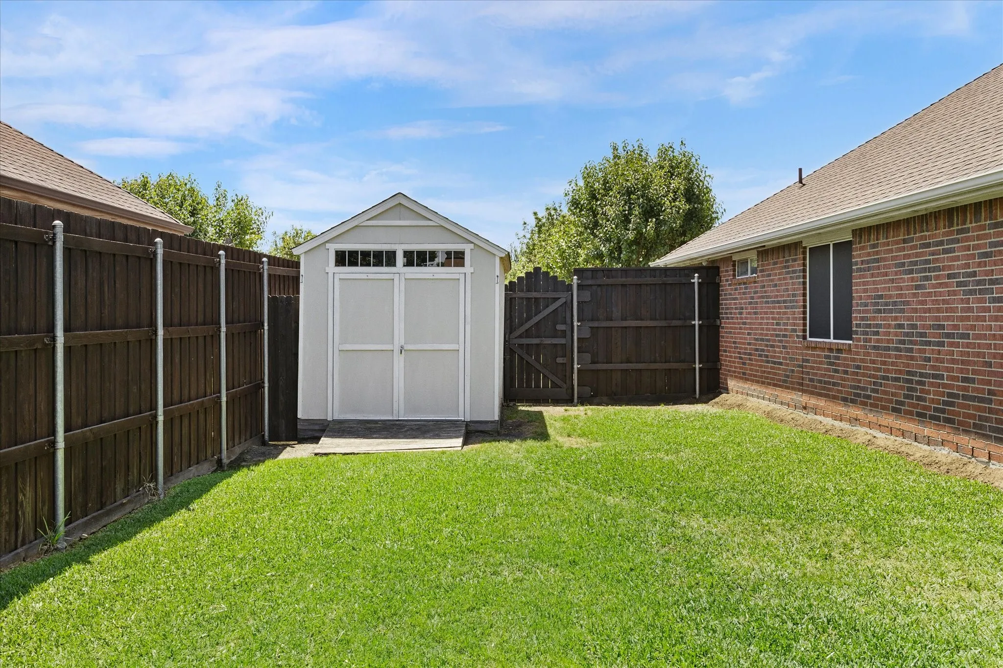 The handy storage shed is approximately 12' x 8', perfect for storing your mower and lawn tools.