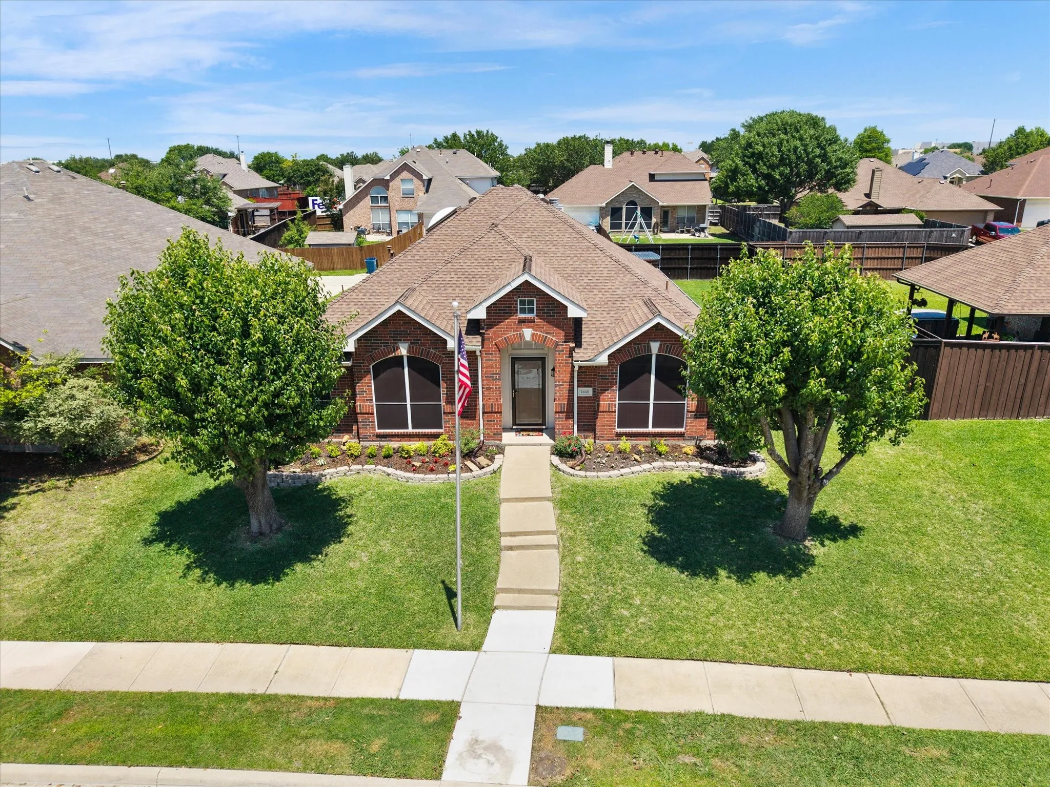 The home features a storm door and solar screens to help with energy efficiency.