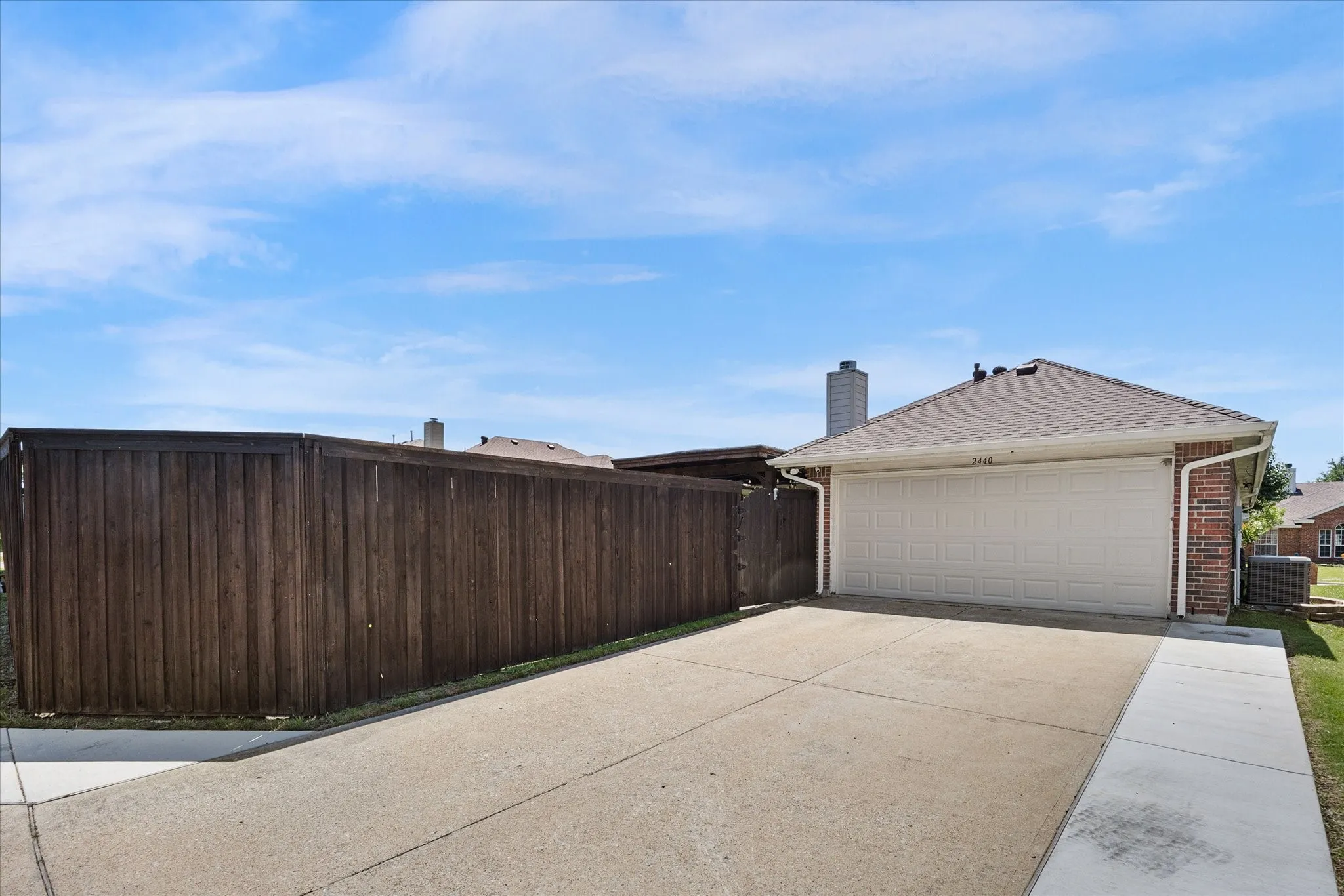 The driveway has been widened to accommodate larger vehicles.