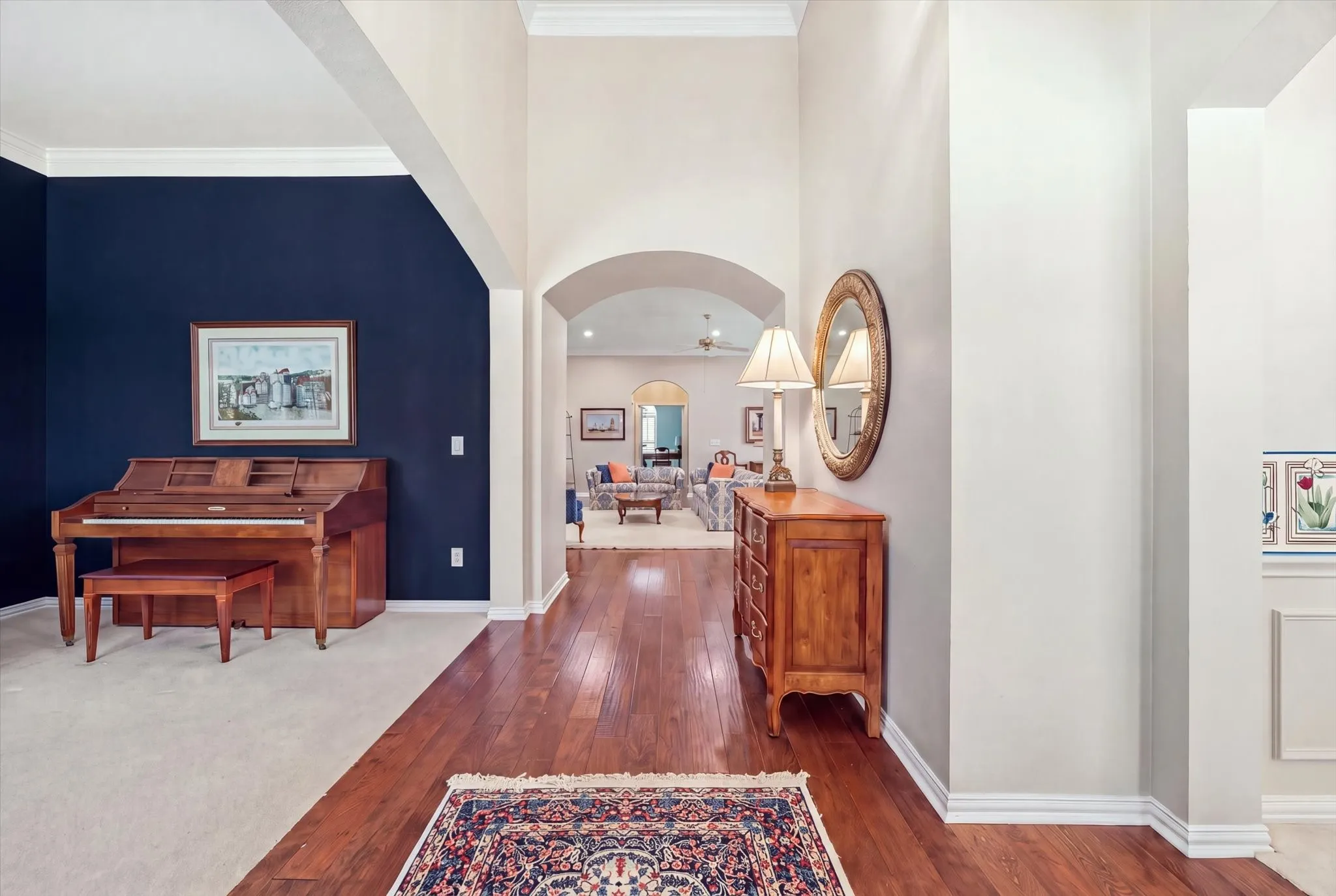Hardwood flooring flows from the foyer into the family room, kitchen, breakfast room, primary bedroom, halls and bedroom 4.
