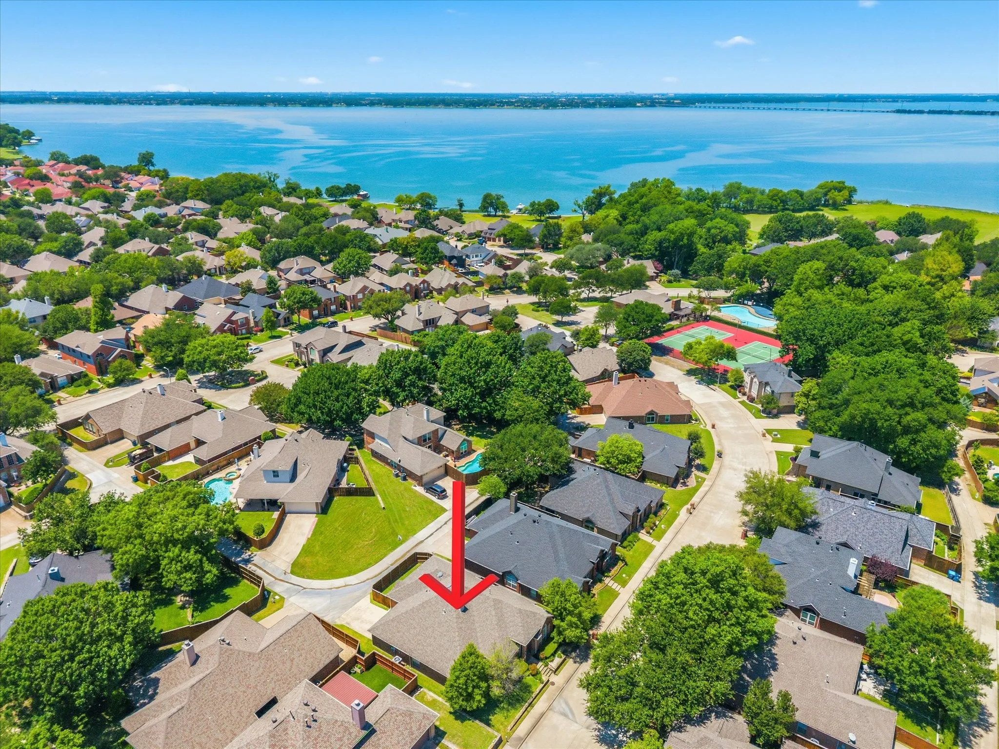 Enjoy low maintenance living in this highly desirable gated lakeside community, where front yard maintenance is included in your HOA dues!