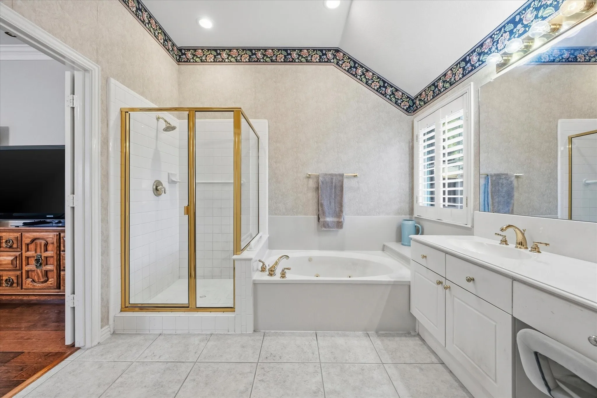 The well-appointed primary bath includes a jetted tub and oversized shower.