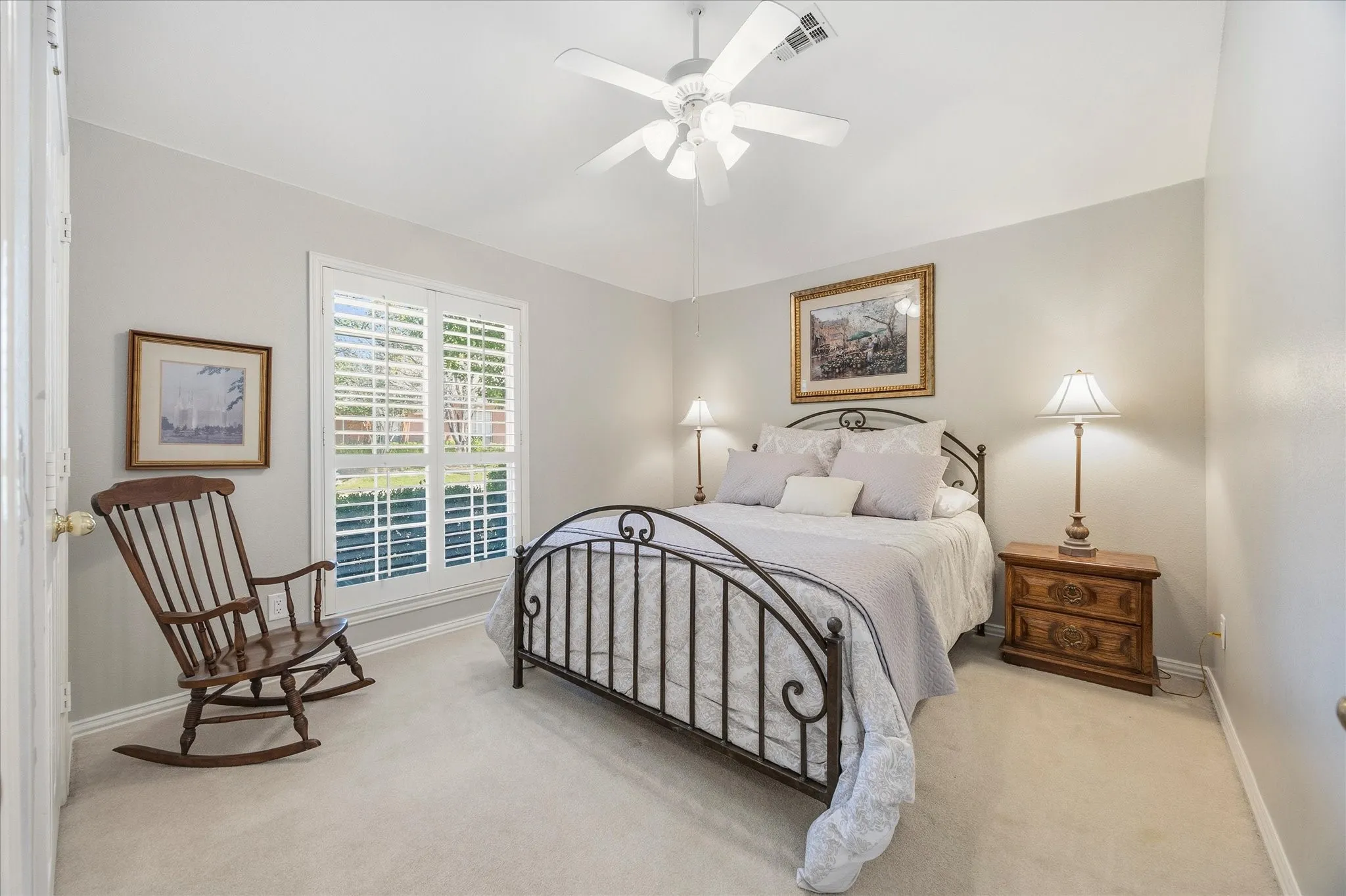 Bedrooms 2 and 3 are positioned at the front of the home and share a nice bath. Bedroom 2 with a ceiling fan and standard closet.