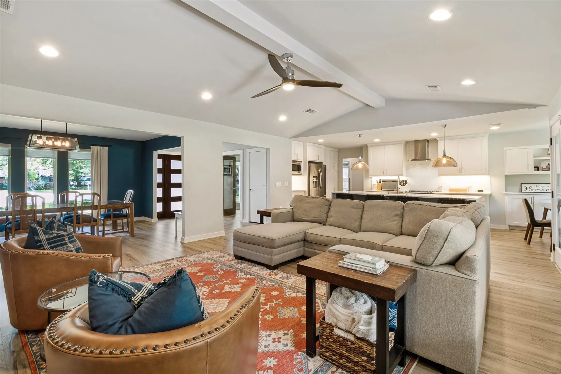 The open-concept layout creates effortless flow between the dining area, living room, and fully renovated kitchen—ideal for entertaining.