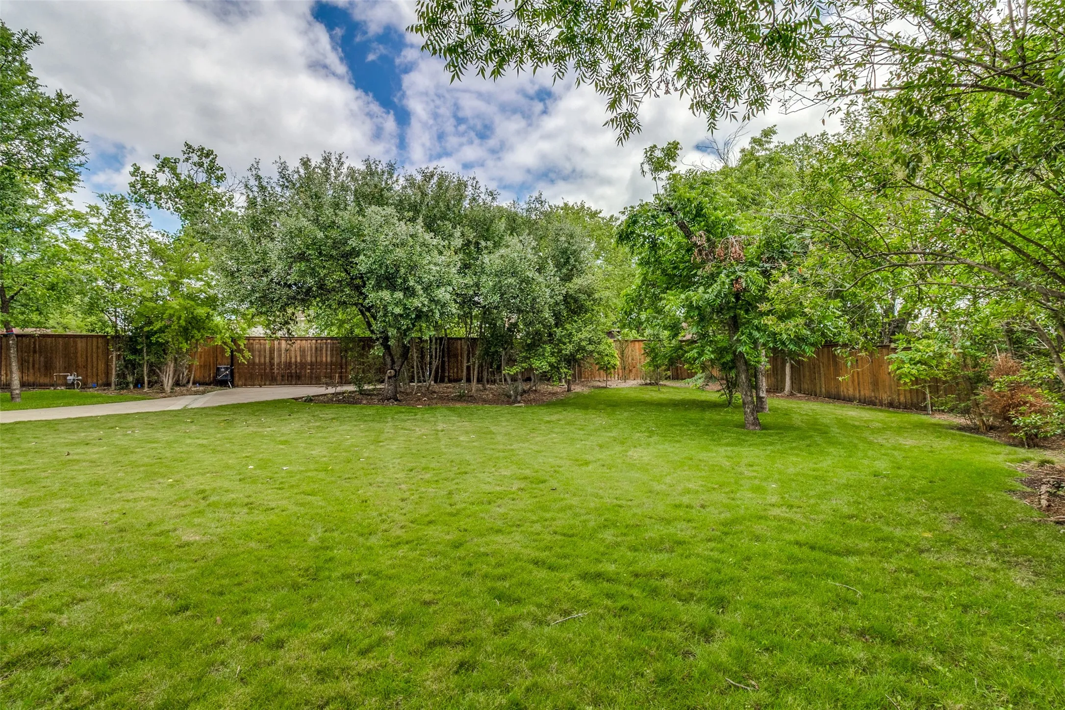 Exceptionally rare lot provides a true sense of privacy and tranquility rarely found in such a central Dallas location.