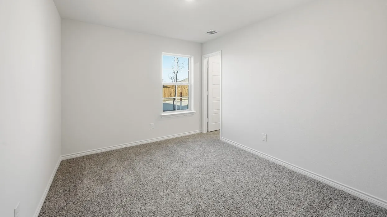Bright room featuring light gray carpeting and white painted walls