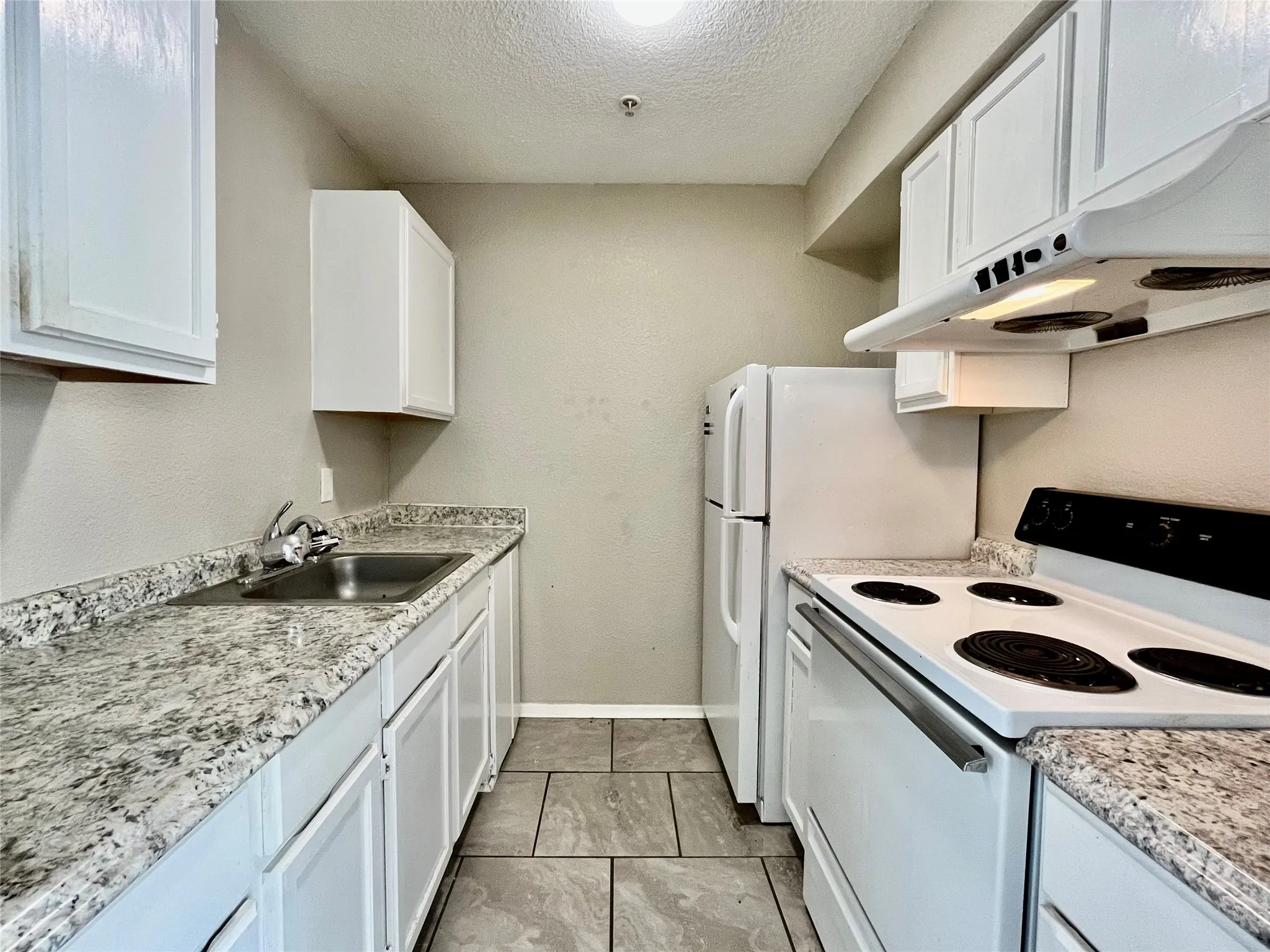 Kitchen with lots of cabinets and counter space.