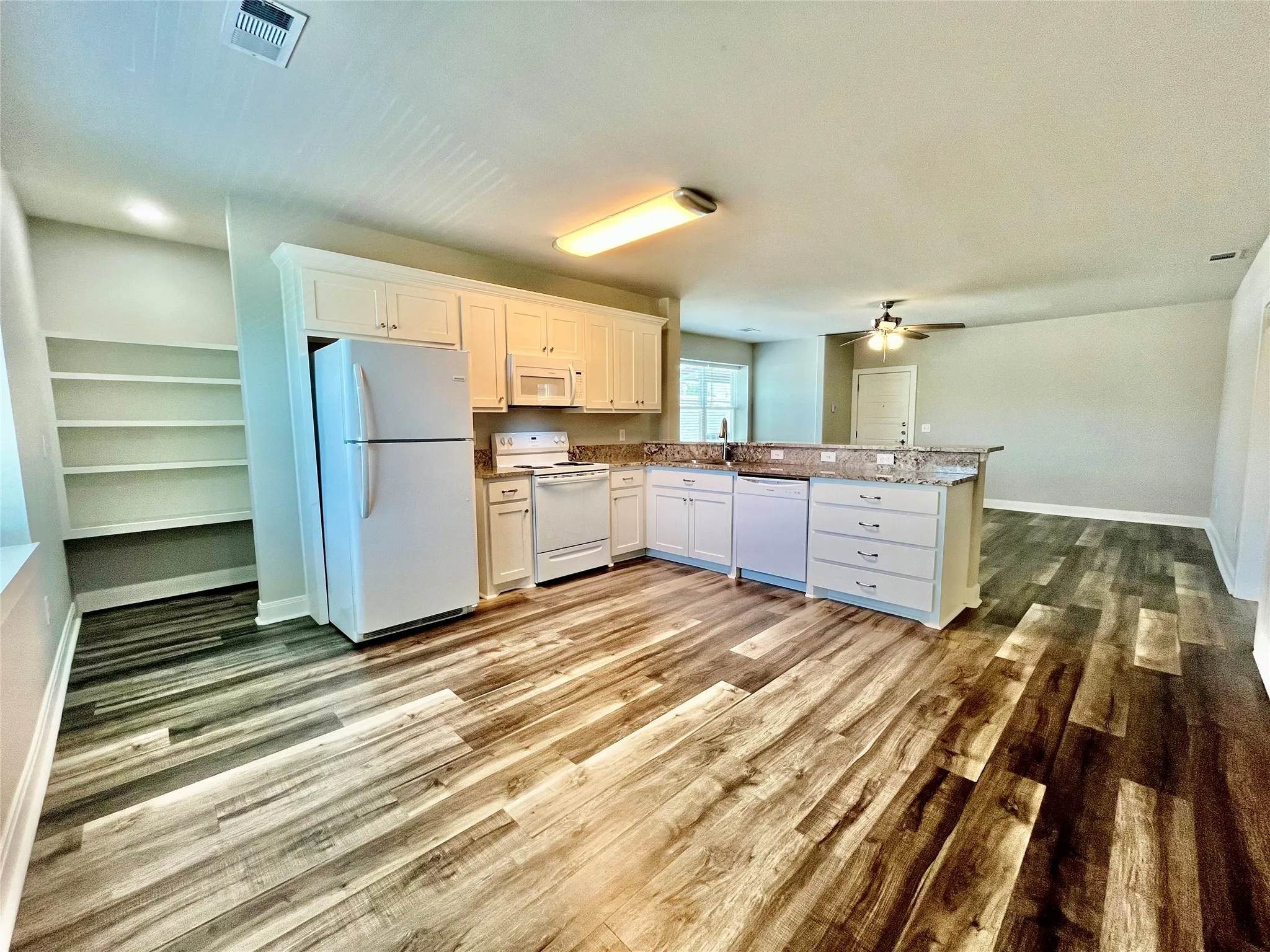 Generously sized kitchen with abundant cabinetry and an airy feel.
