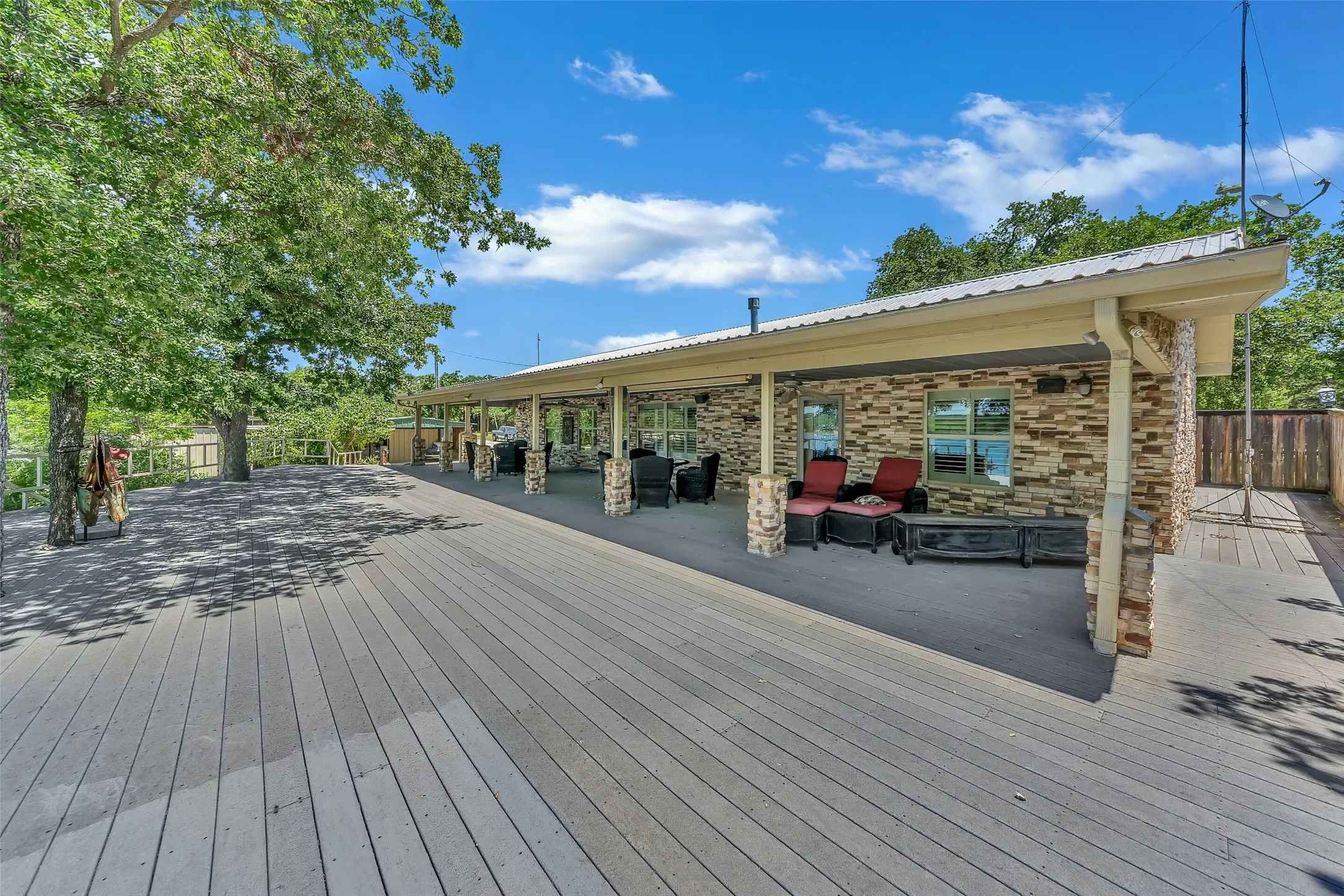Expansive outdoor deck featuring wood-finish flooring
