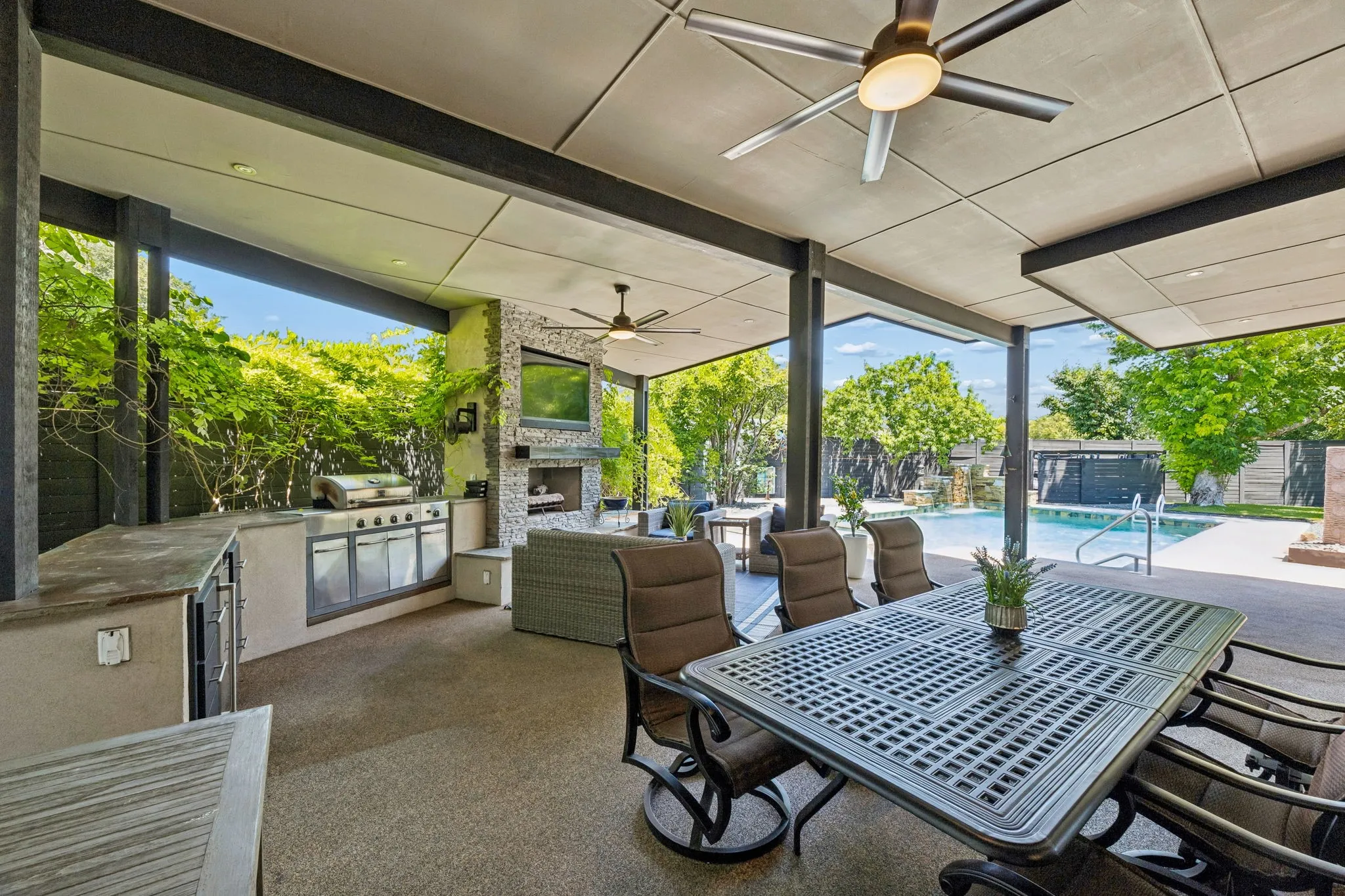 Grilling station, fireplace, lighting, fans, large seating area, & so much more!