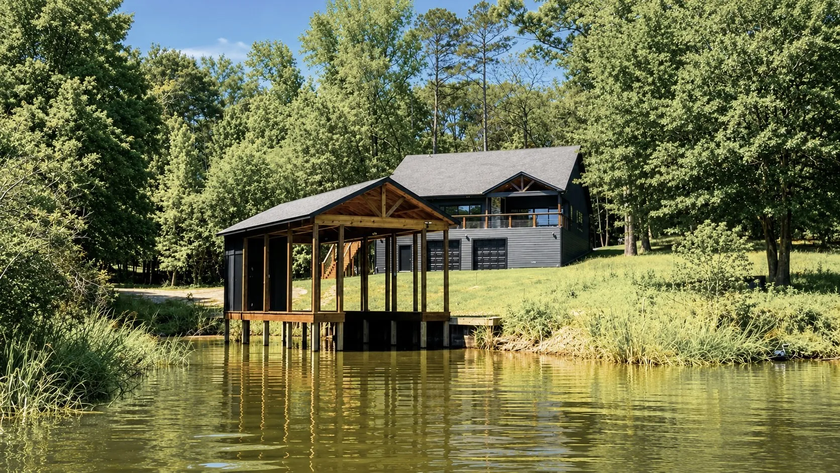 Waterfront property featuring a private boat dock with a covered slip and additional open storage