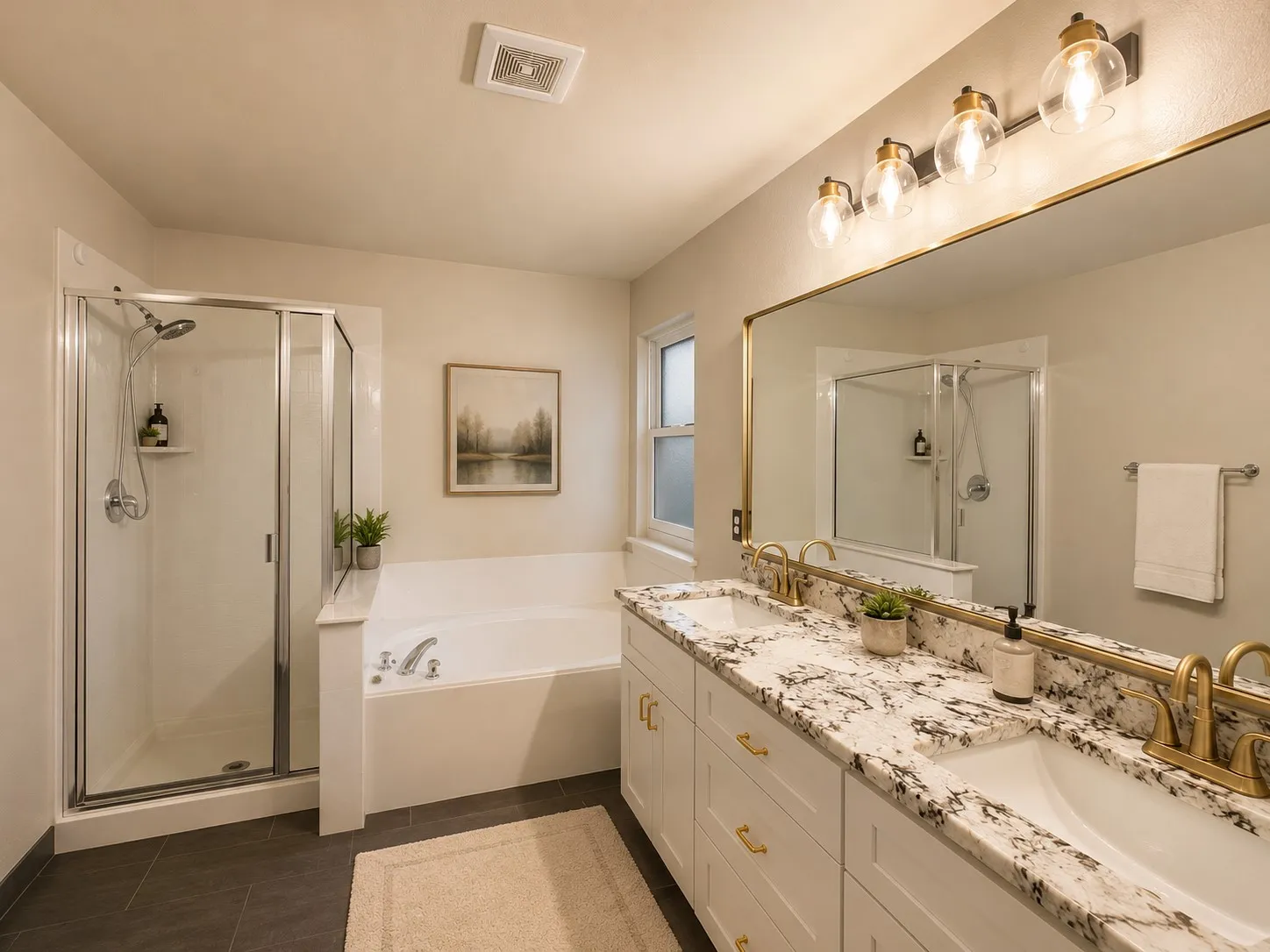 Contemporary bathroom featuring a double vanity with granite countertop and gold-finish fixtures, a glass-enclosed shower, and a built-in soaking tub