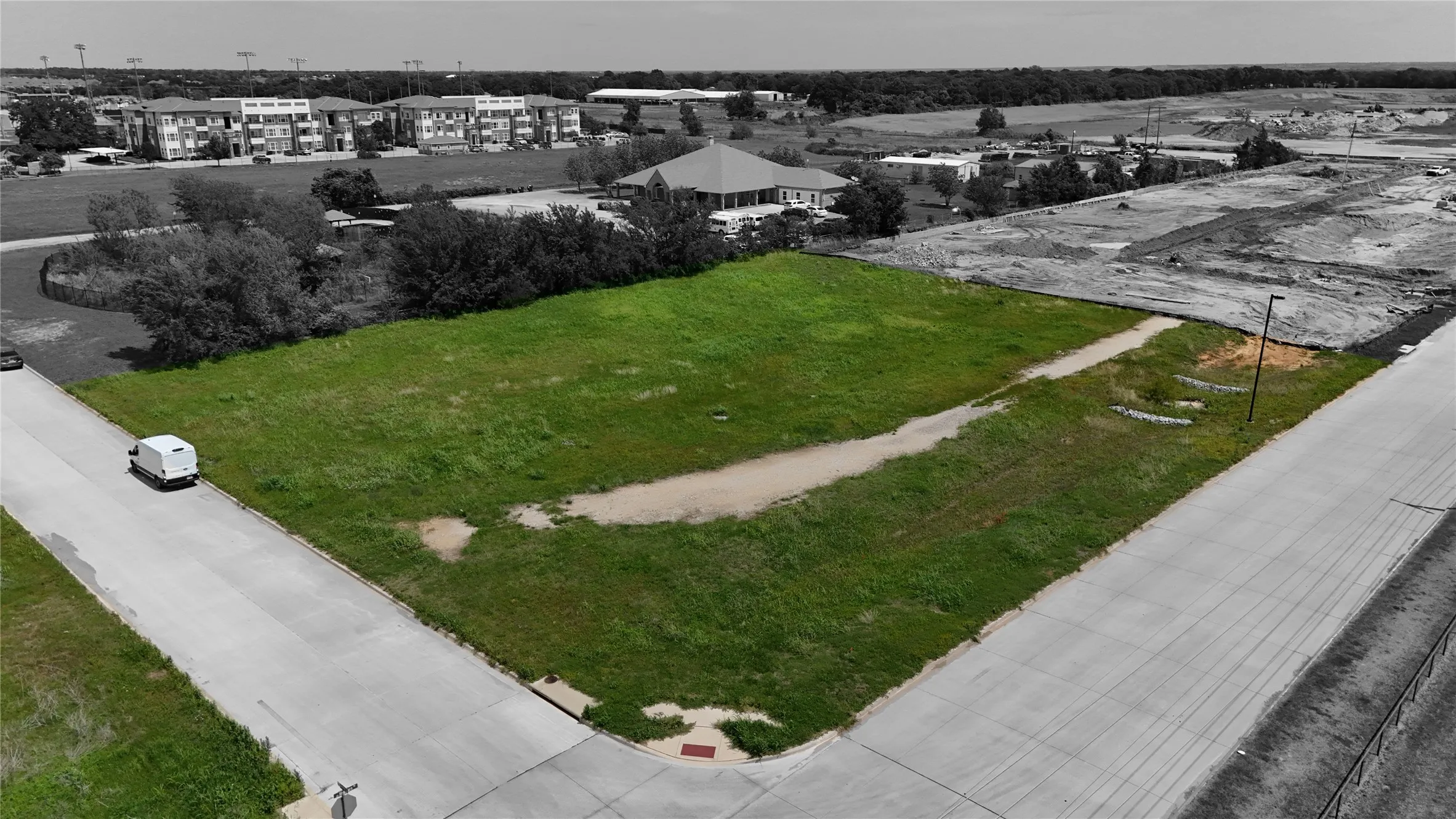 Expansive grass lot featuring street frontage on two sides