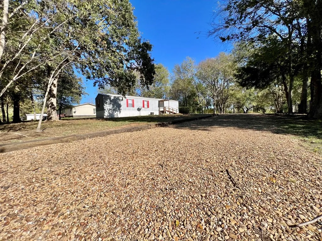 Mobile Home For Sale in Henderson County , 304 Wildwind Street, Gun Barrel City, Texas 75156, 3 Bedrooms, 1 Bathroom, Garage spaces, 754 Sqft, built in 2005, Price $119,900, mls#21269052, Real Estate Agent in Gun Barrel City, Homes For Sale in Henderson county, Homes For Sale in Gun Barrel City, Realtor in Gun Barrel City Texas, Real Estate Brokerage Independent Realty Texas, Luminita Cordes Realtor