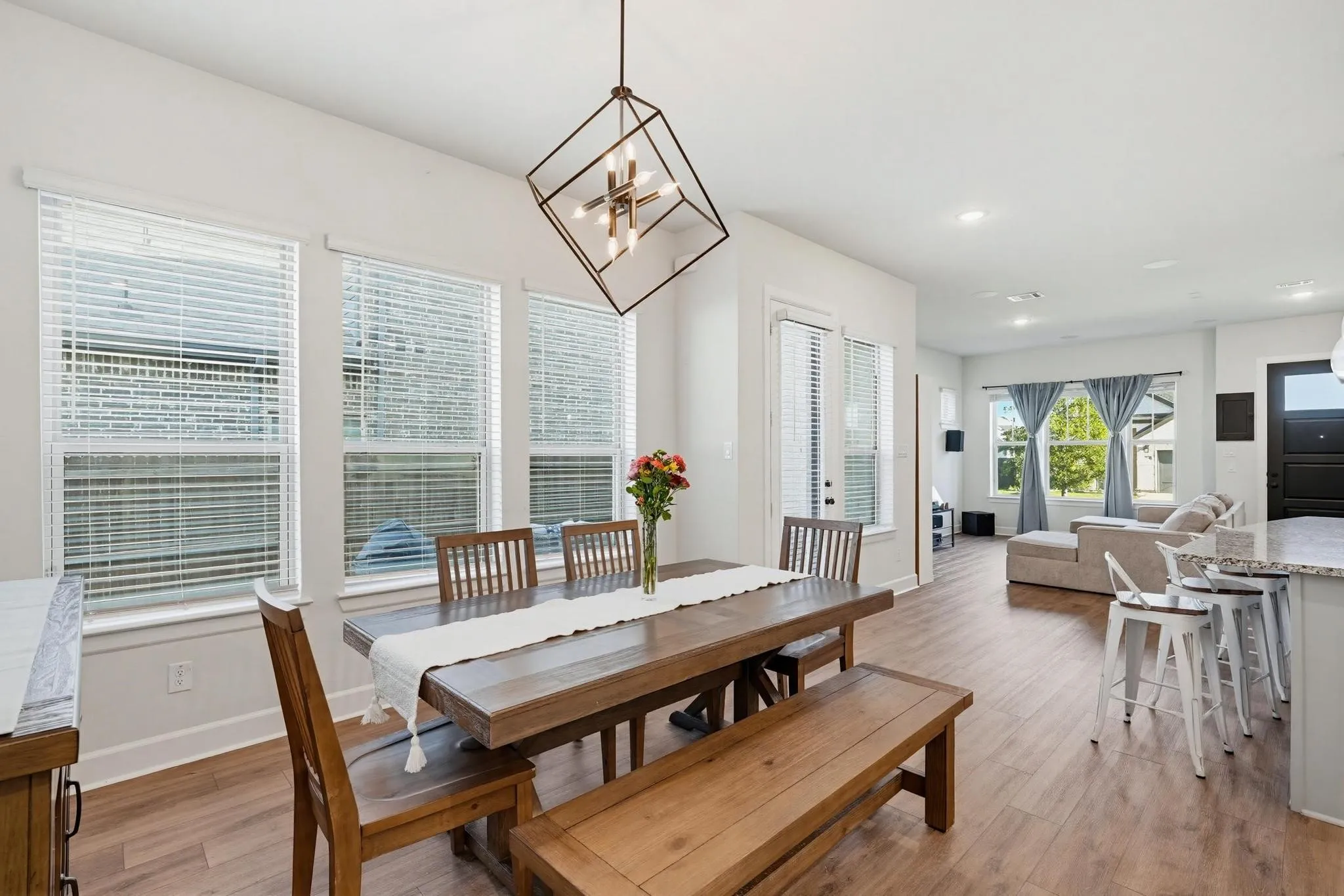 Open-concept living area with abundant natural light from multiple windows