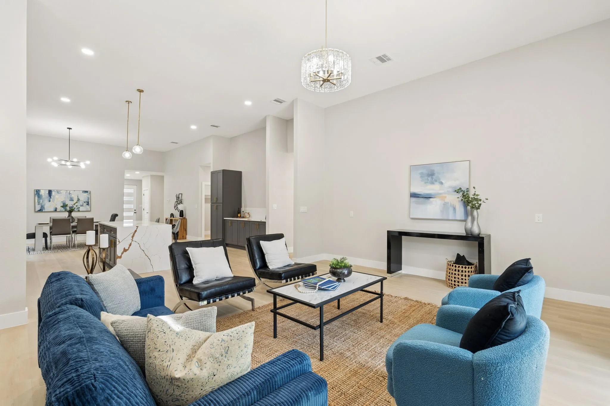 Open-concept living area featuring light wood-finish flooring and neutral wall tones